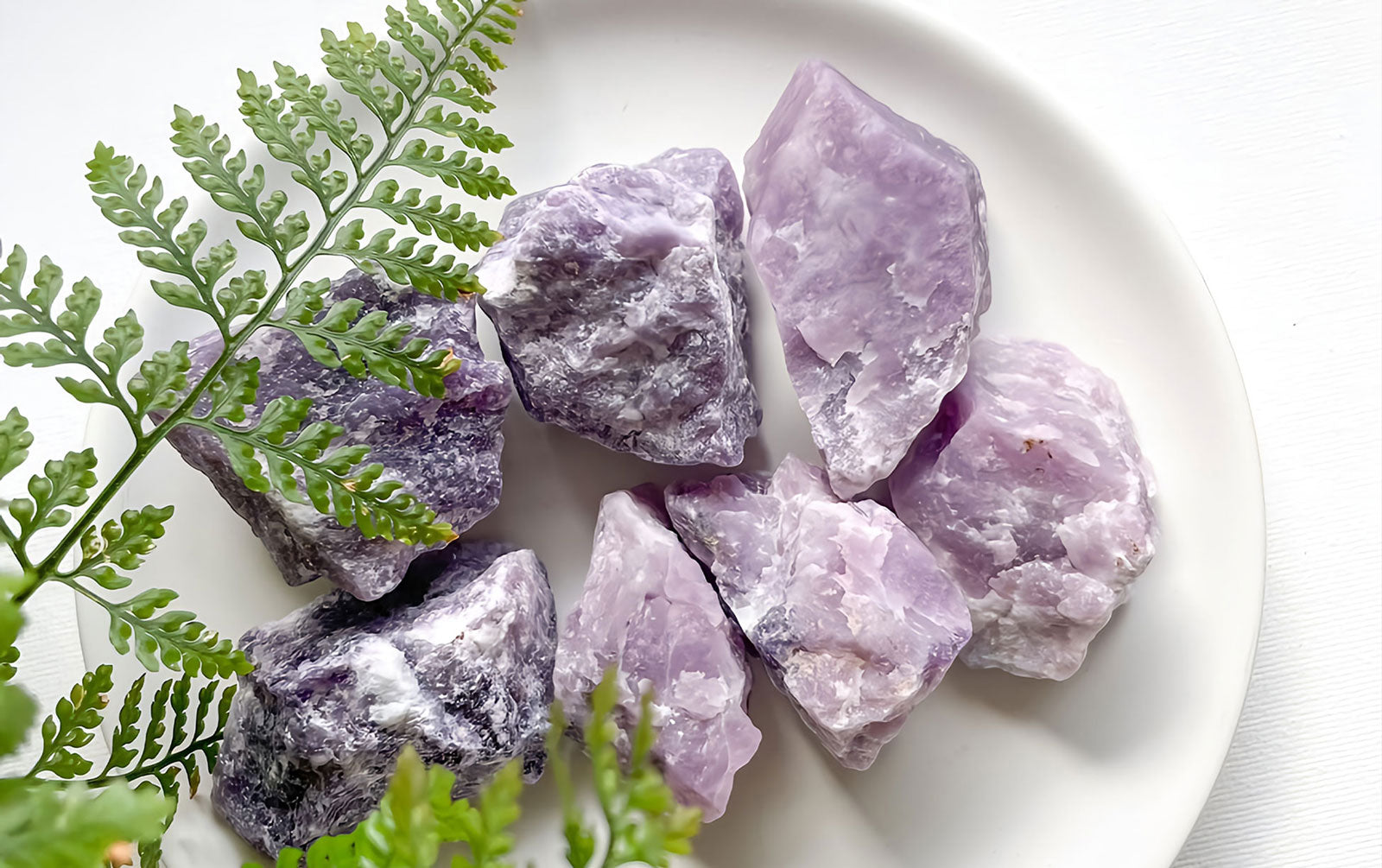 Natural Lepidolite stone with rough texture and vibrant pink and purple colors