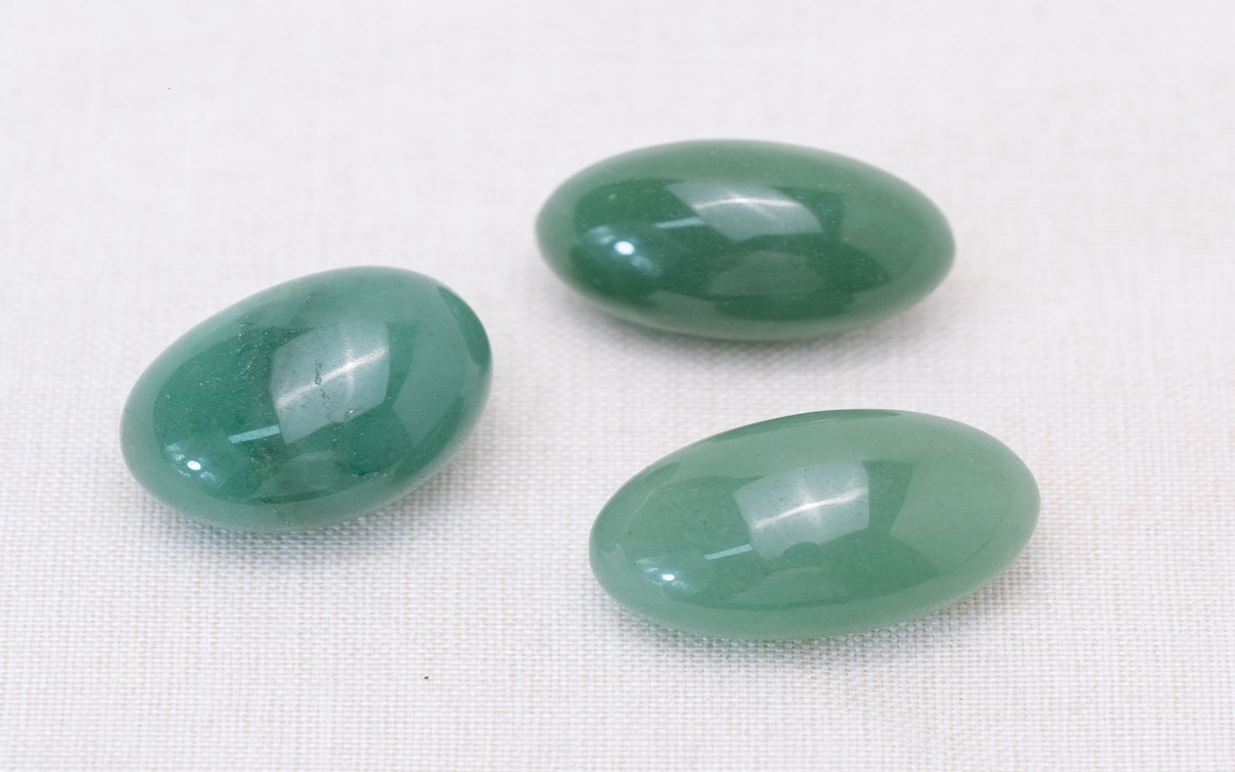 Close-up of aventurine stones scattered on the ground