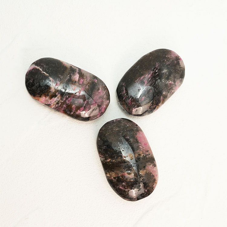 Black Rhodonite Palm Stone for Chakra Balancing and Alignment