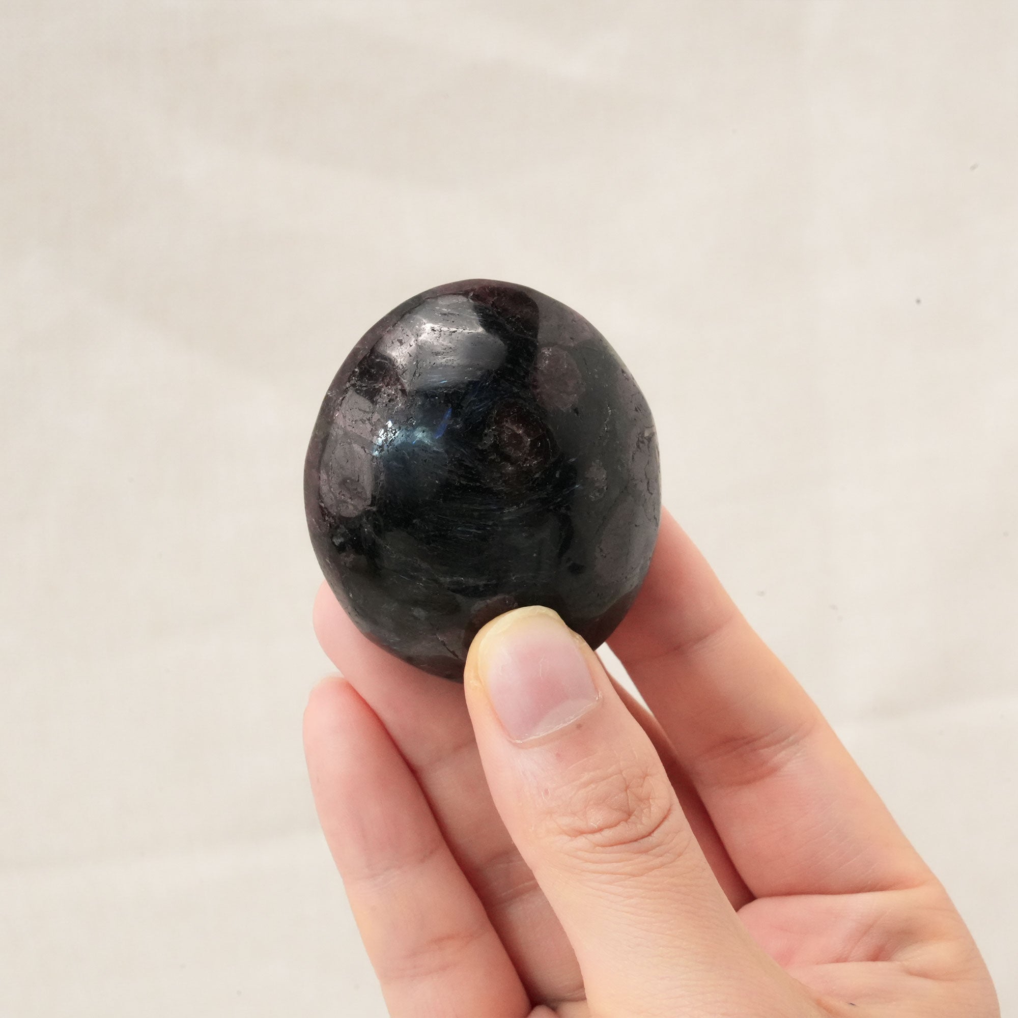 Smooth Garnet Palm Stone used for grounding and stabilizing energy
