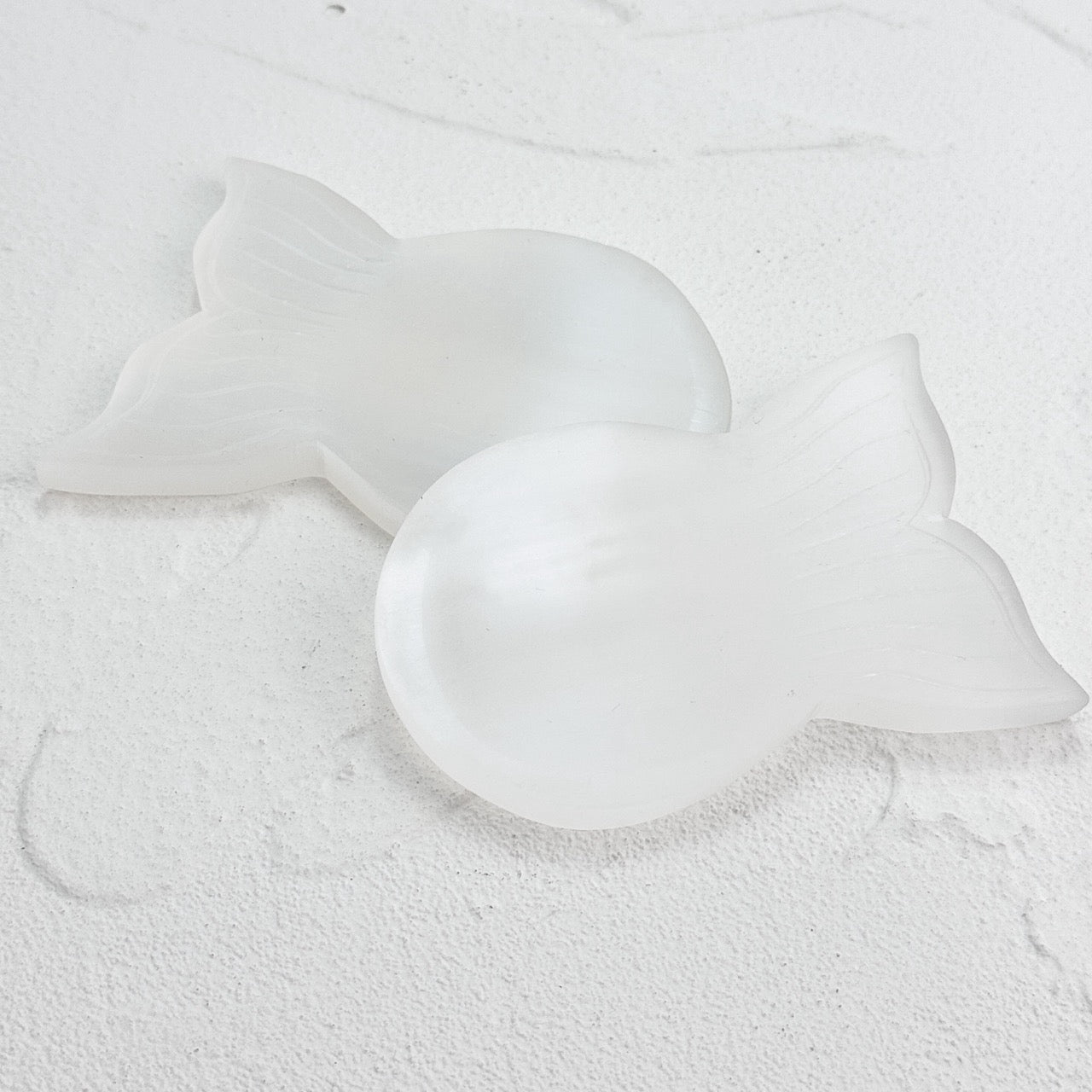 Selenite Fishbowl Carving acting as a purifying station for crystals