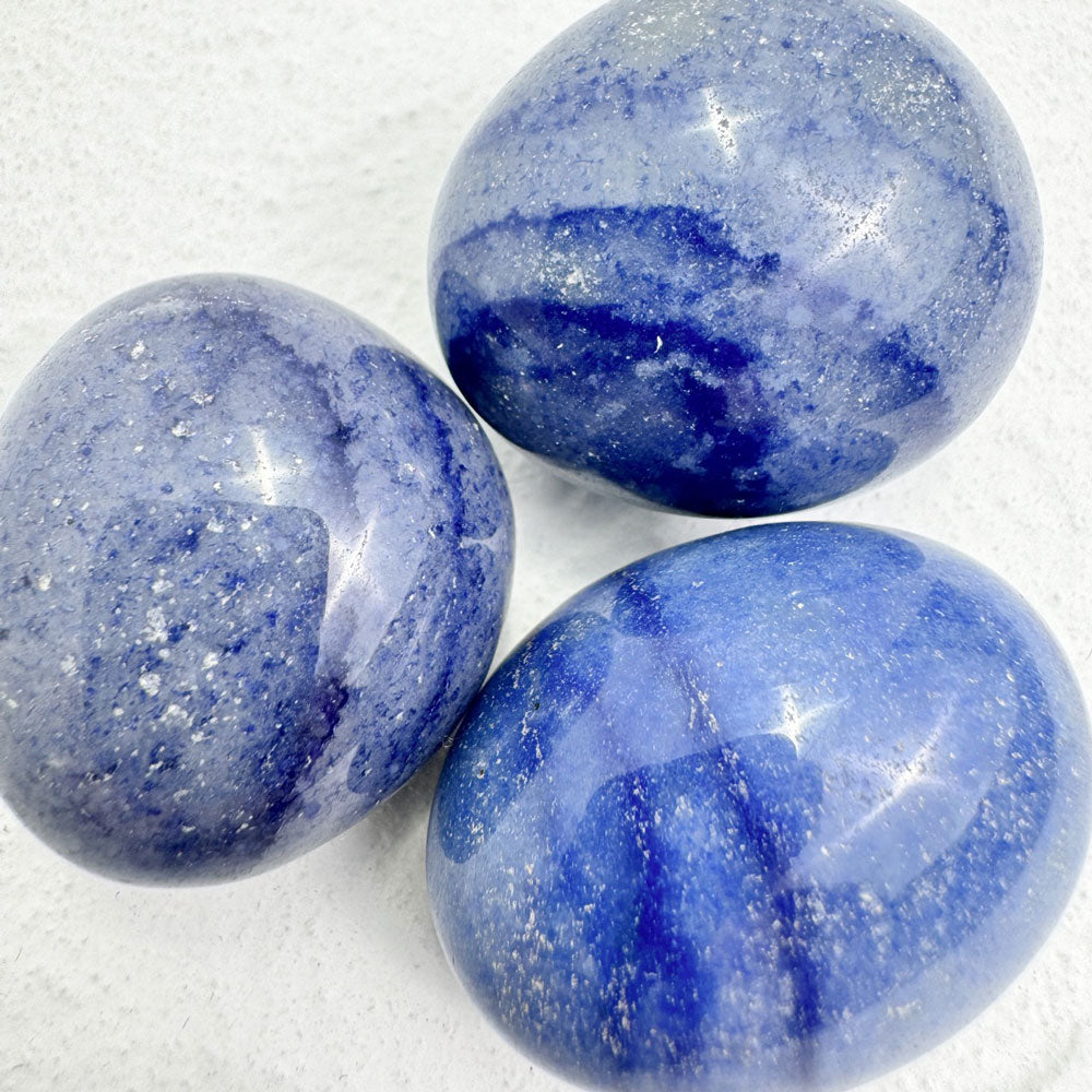 Blue aventurine tumbled stones arranged beautifully