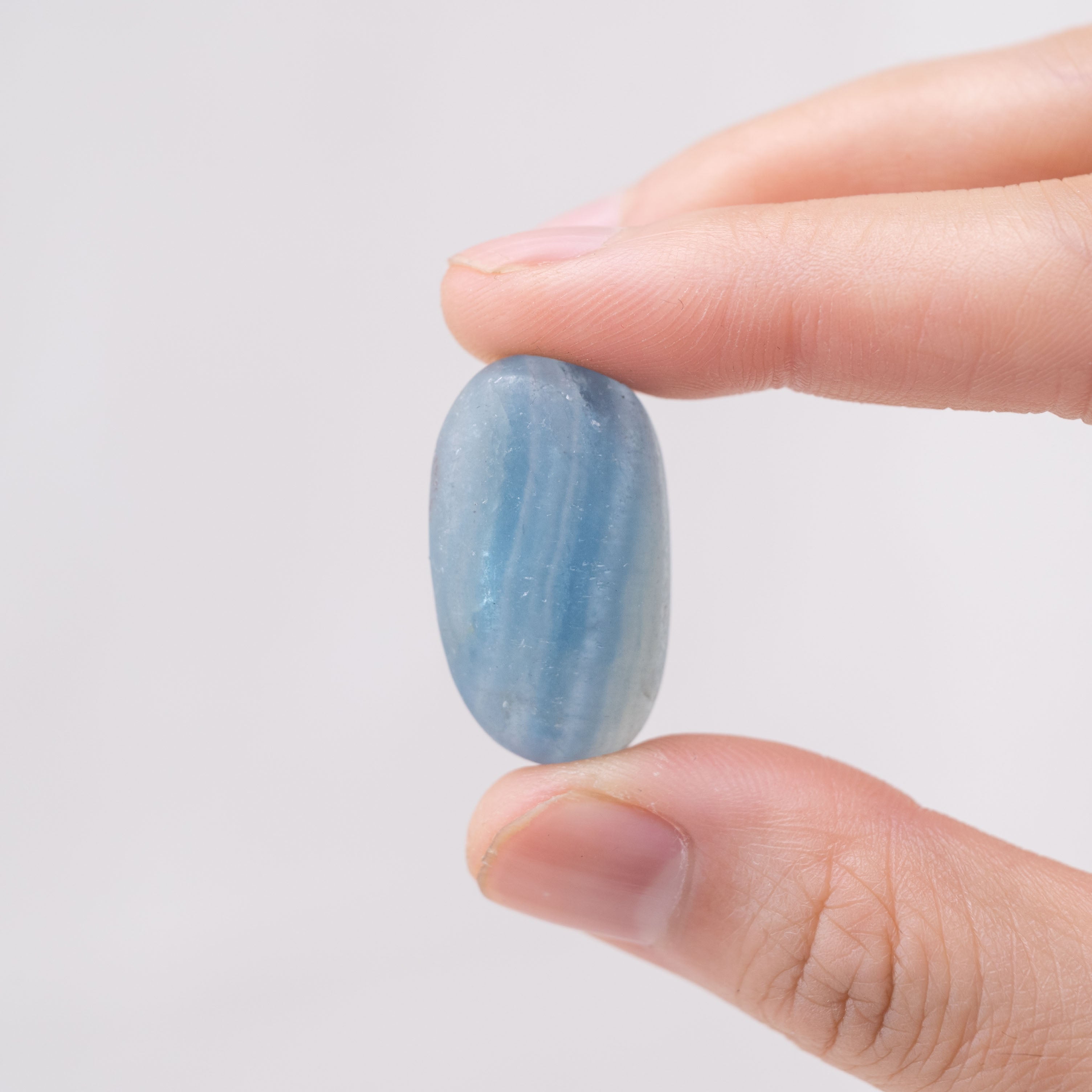 Laid-out Blue Onyx tumbled stones for calm and focus.