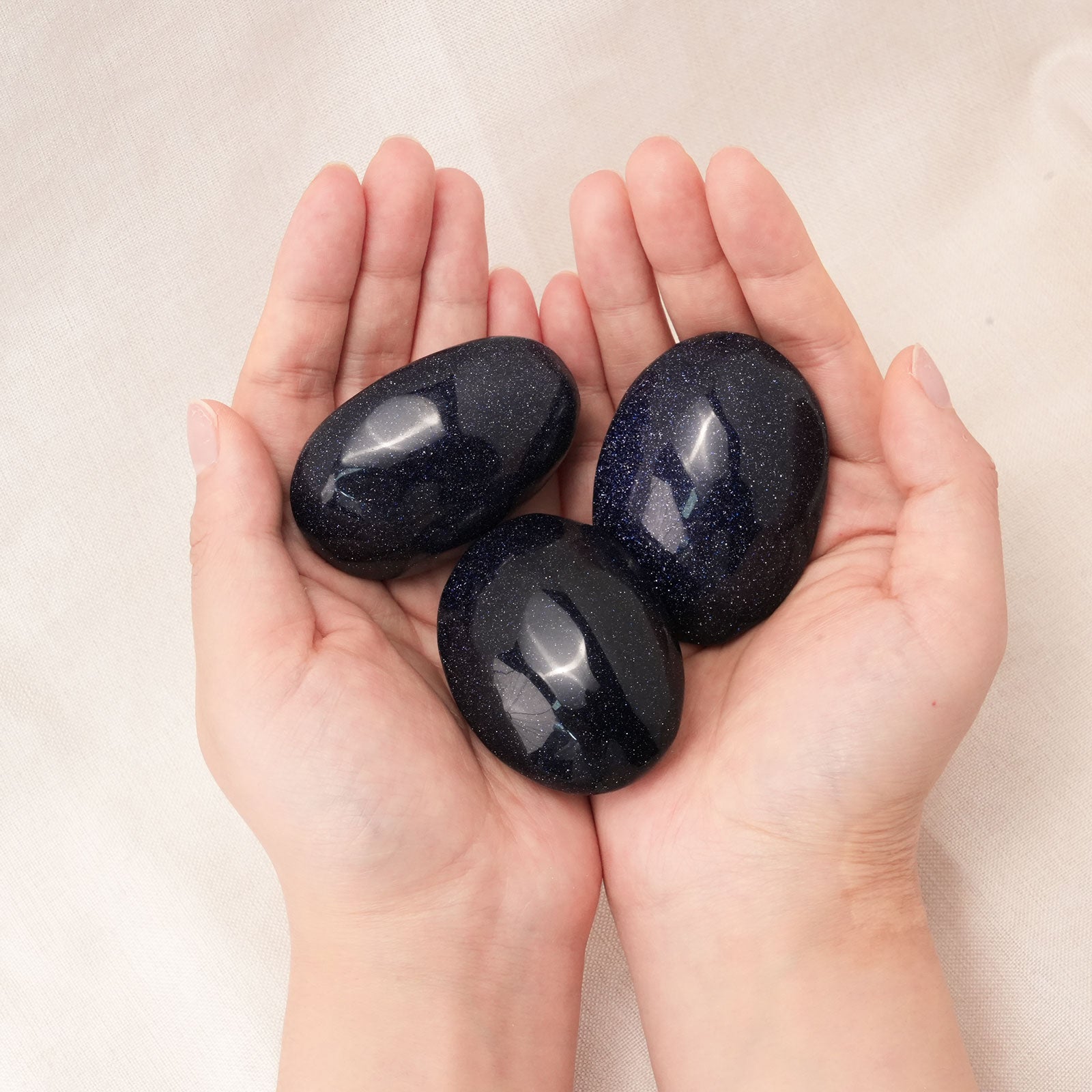 Blue Sand Stone Palm Stone aiding in stress relief and emotional balance