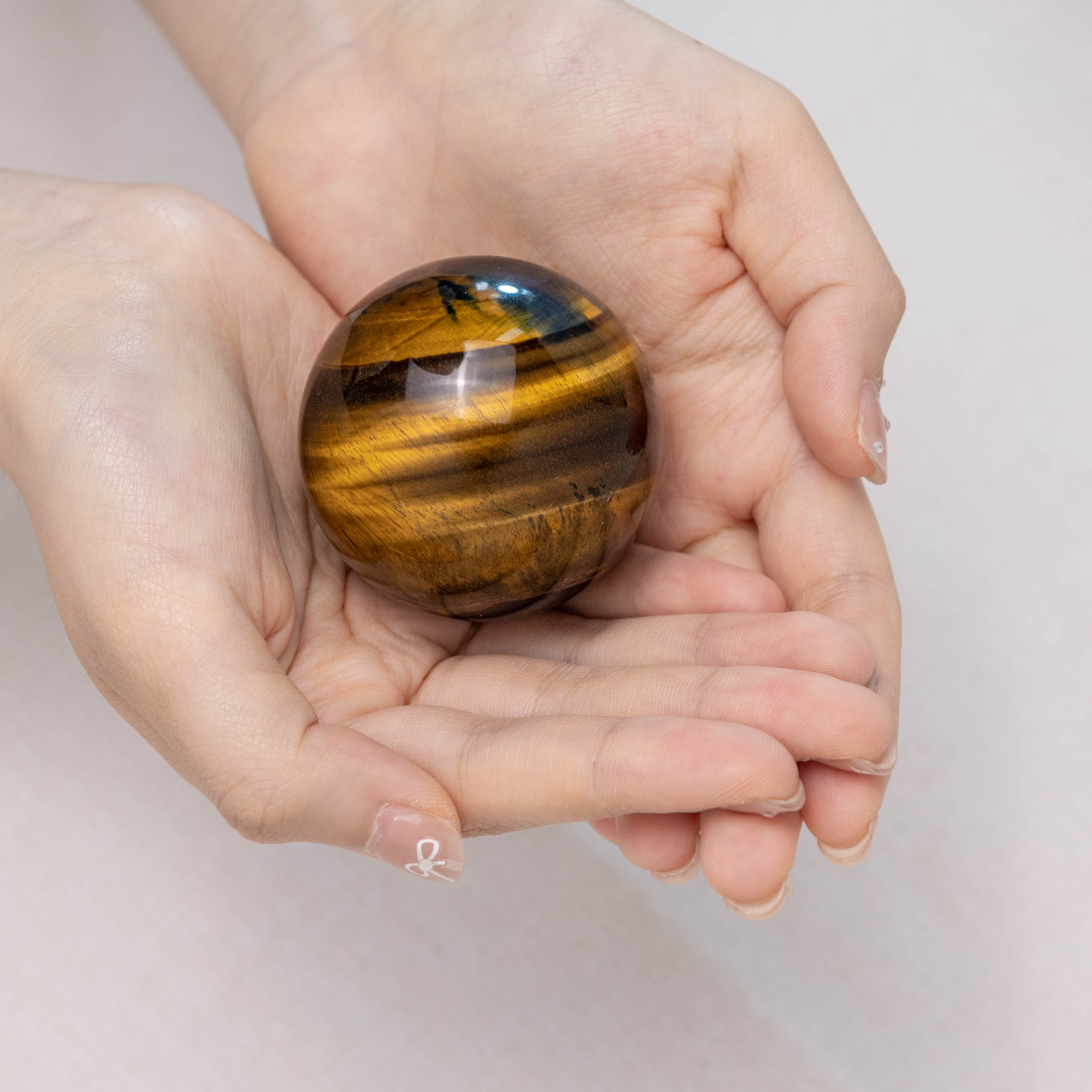 Blue Tiger Eye Stone Sphere with reflective blue tones