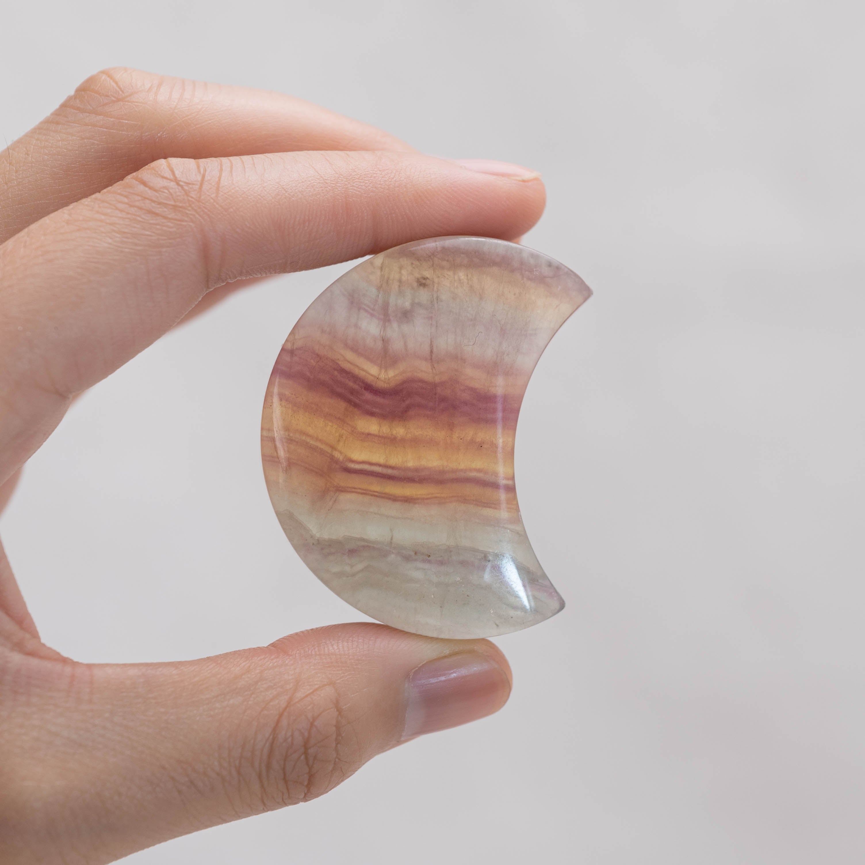 Detailed view of Candy Fluorite Moon Palm Stone