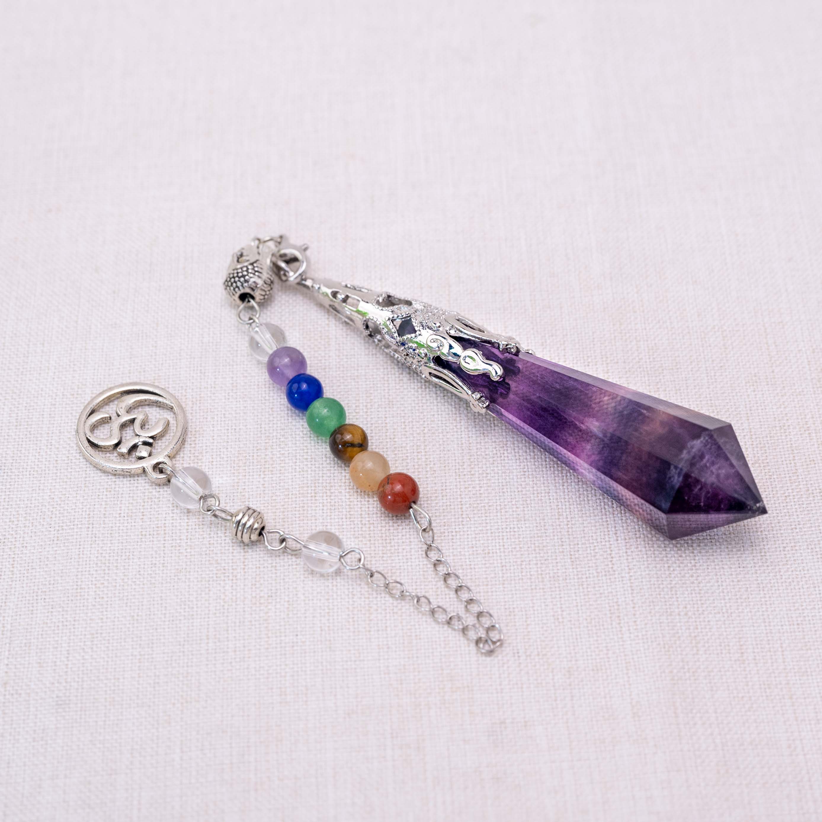 The Fluorite Seven Chakra Pendulum aligns your chakras and balances your energy for spiritual growth.
