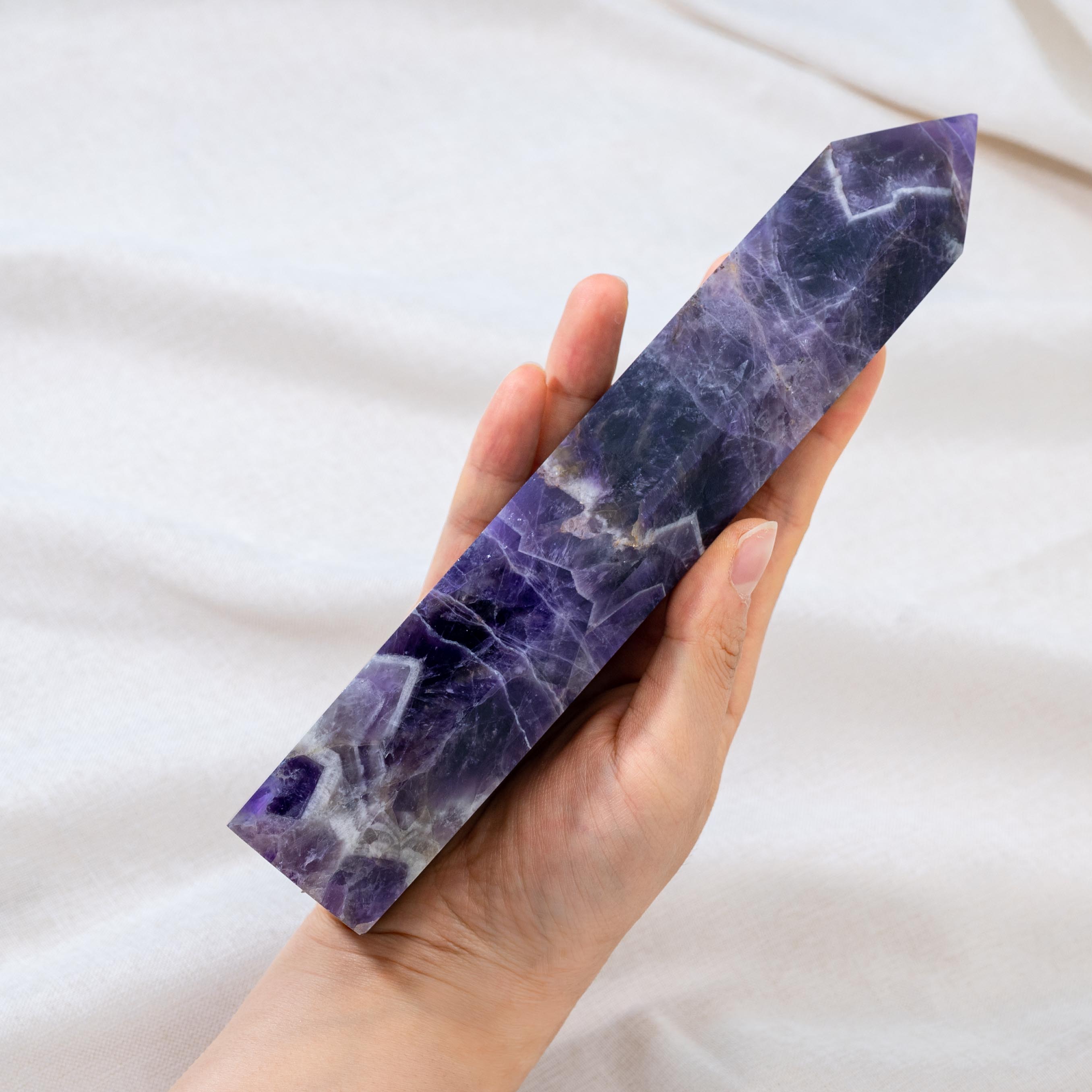 Dream Amethyst Tower is celebrated for its ability to improve mental clarity and enhance focus, ideal for meditation and mindfulness practices