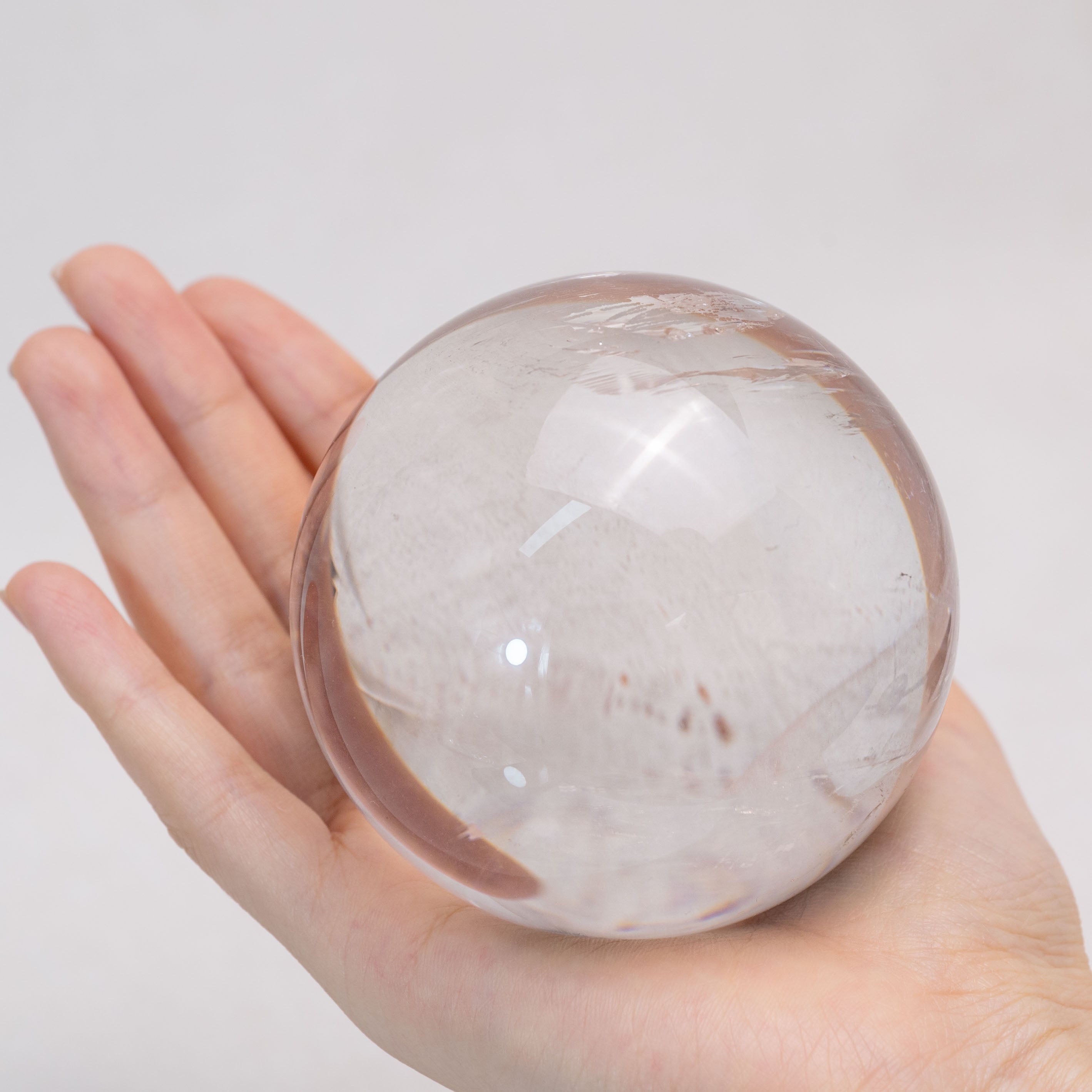 Clear Quartz Sphere with radiant clarity and powerful energy amplification