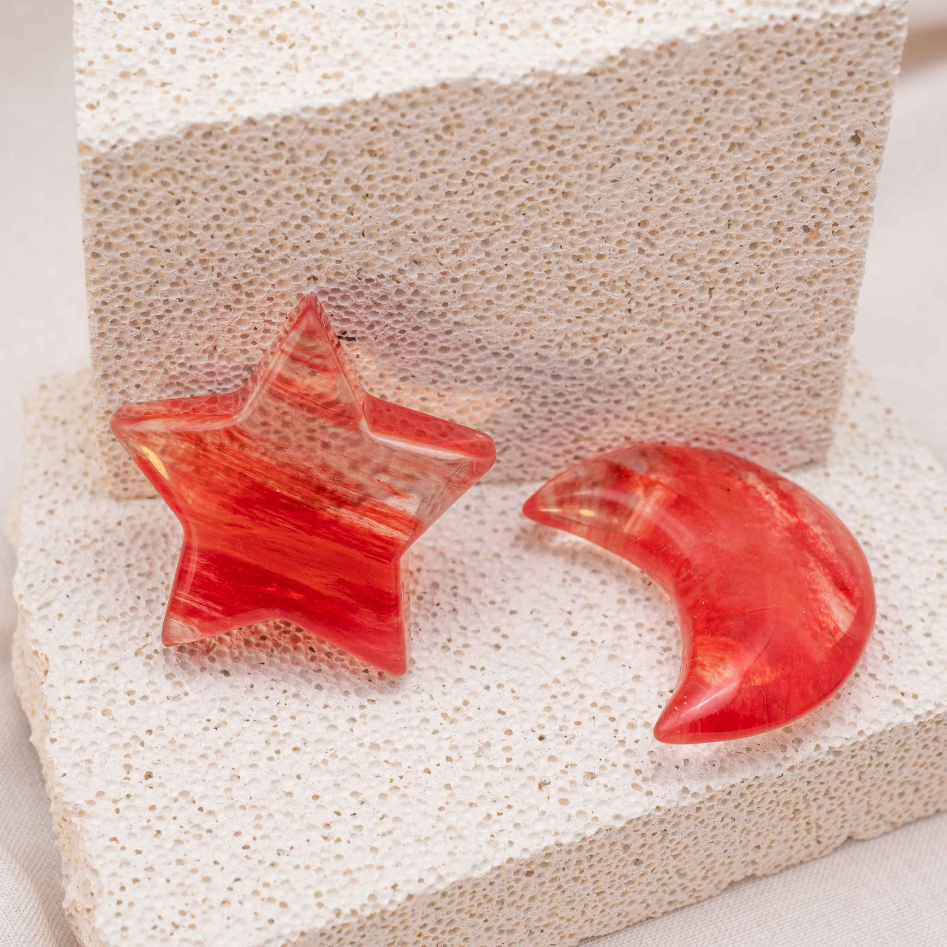 Display of Red Smelting Quartz Star/Moon Palm Stone