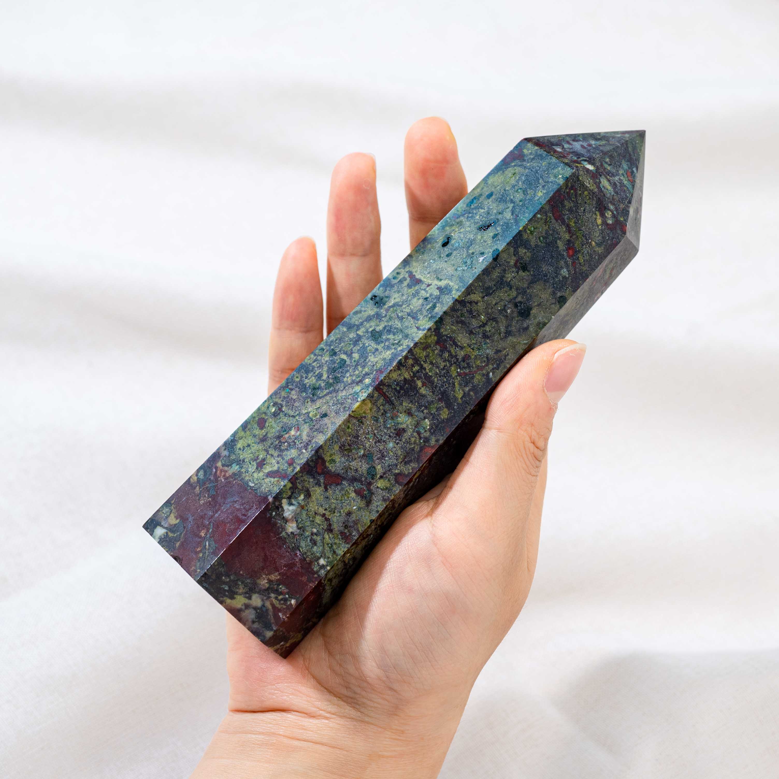 With its striking appearance, the Dragon Blood Stone Tower serves as both a decorative piece and a powerful healing tool