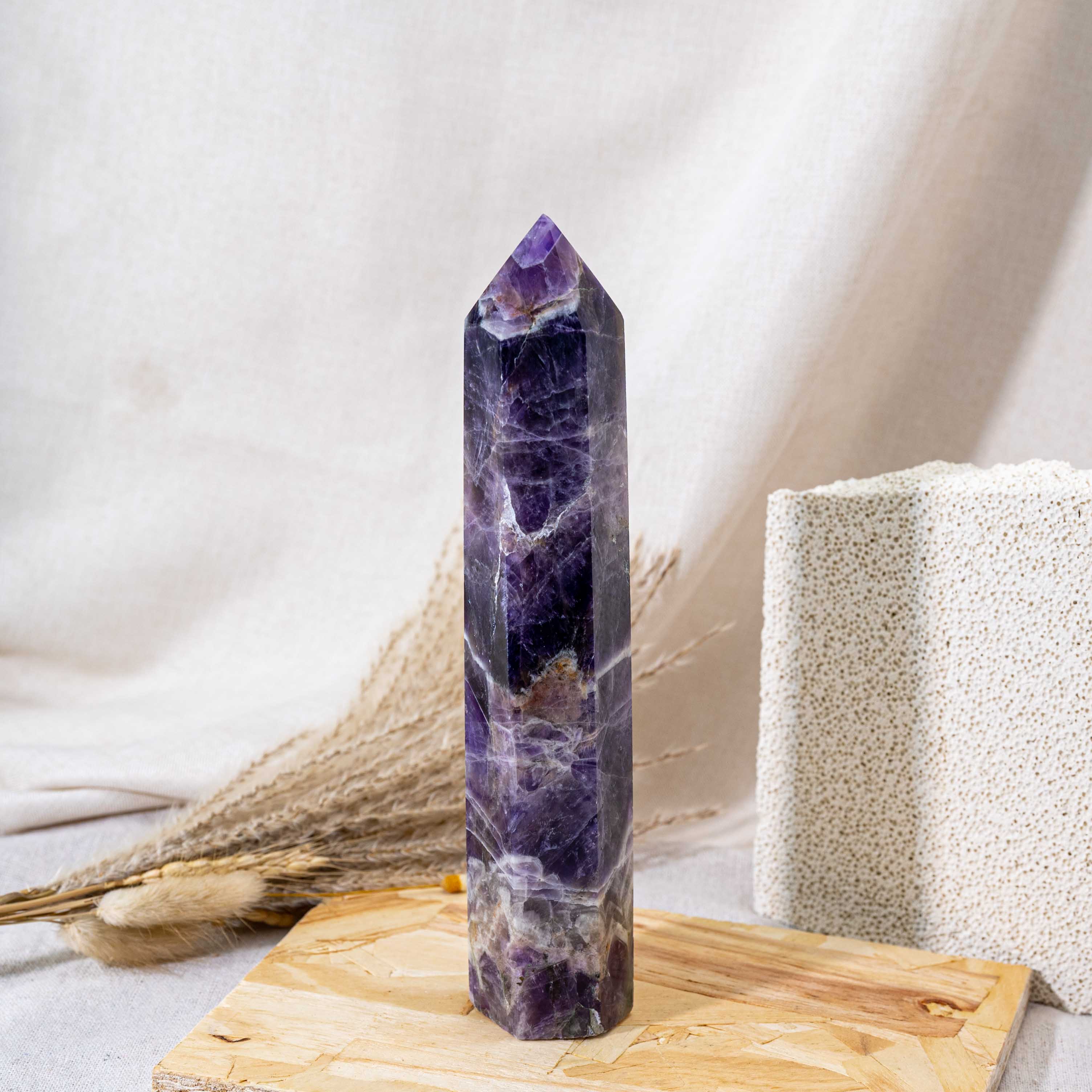 The Dream Amethyst Tower is a powerful healing crystal known for its beautiful blend of purple hues, promoting spiritual growth and inner peace