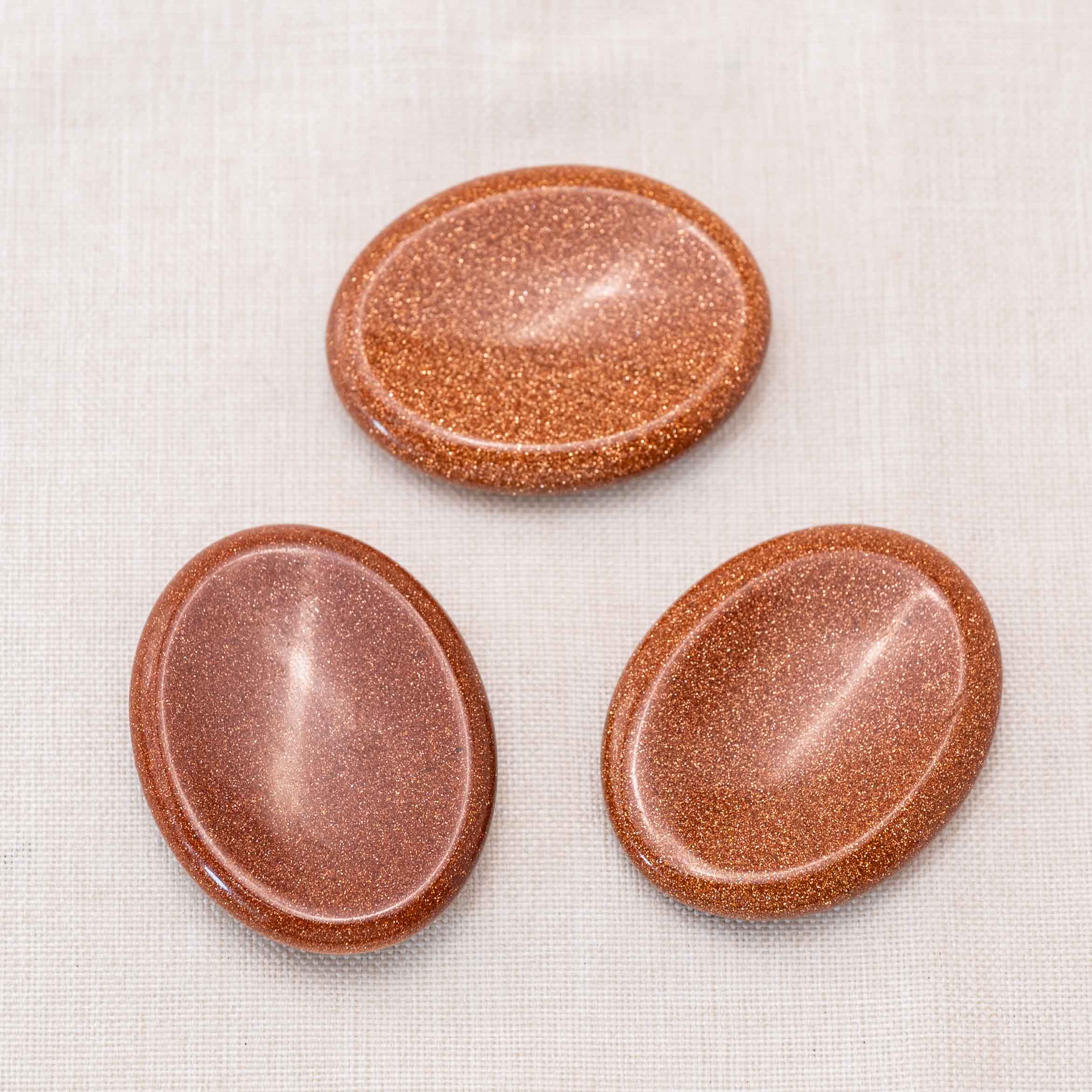 Experience the uplifting energy of the Gold Sand Worry Stone throughout the day