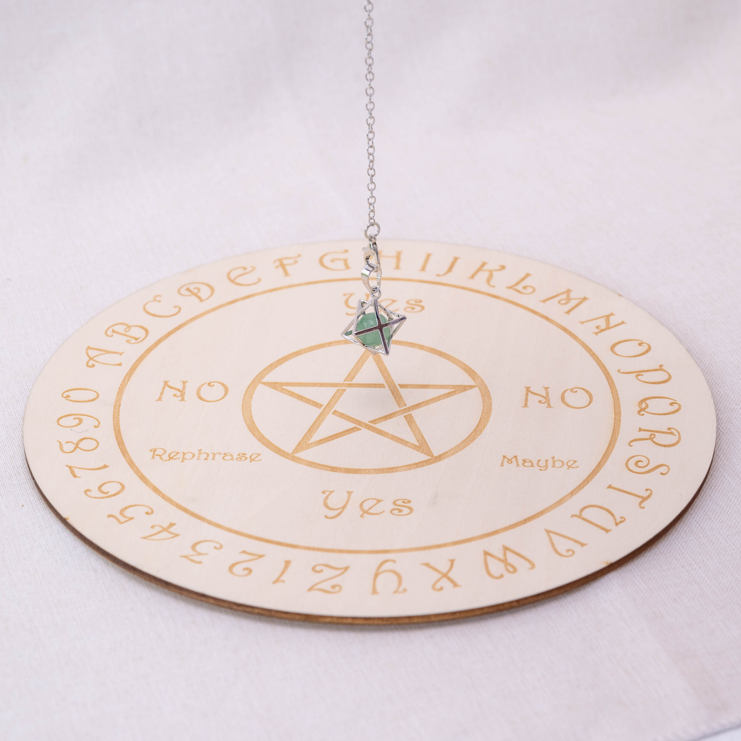 Detailed view of Green Aventurine Merkaba-shaped pendulum