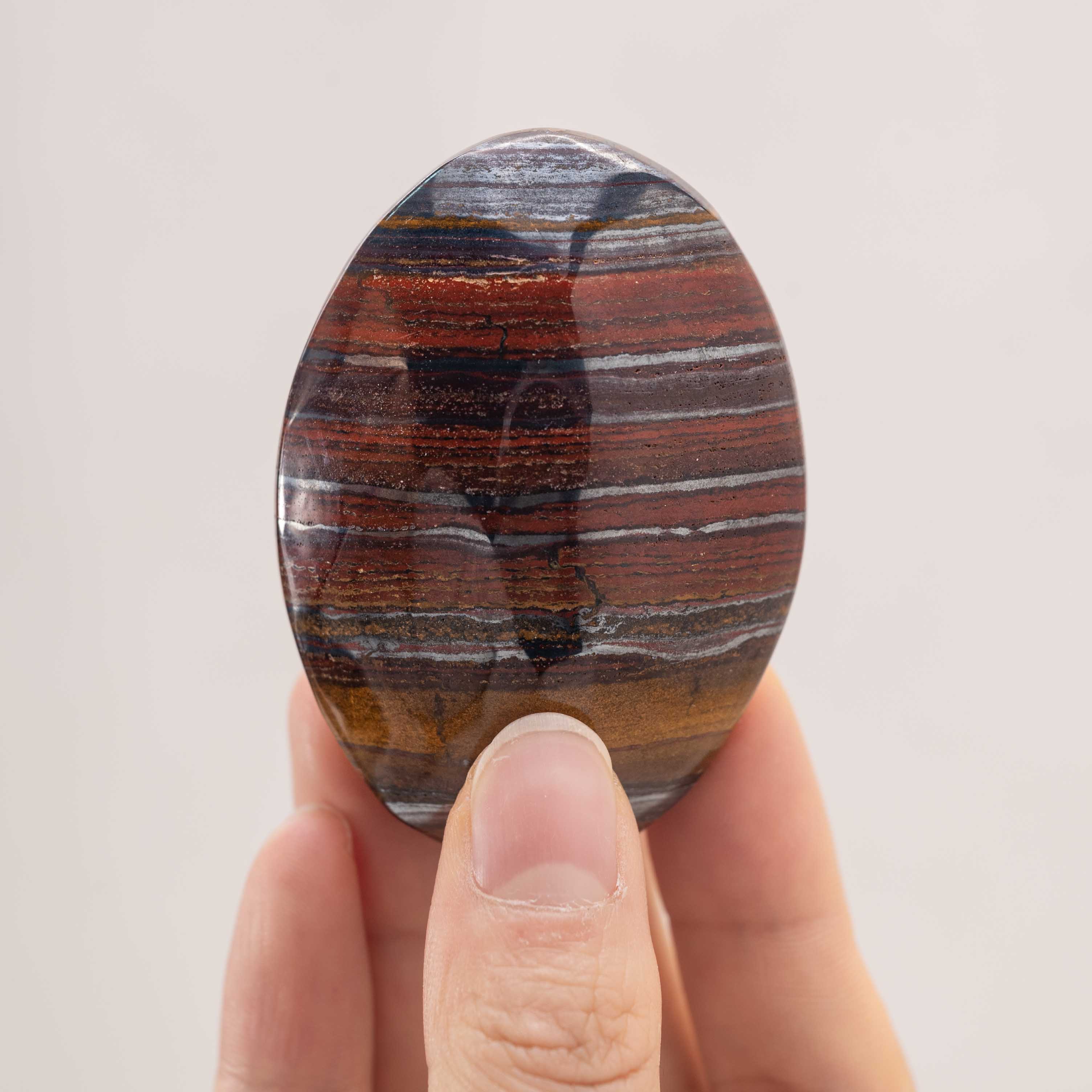 Iron Tiger Eye Stone Palm Stone showcasing its healing properties