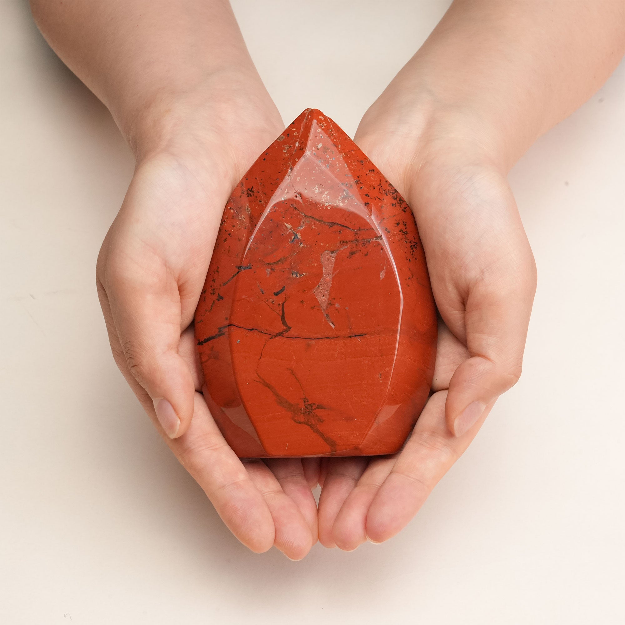 Red Jasper Freeform Crystal in a serene setting, promoting stability and vitality