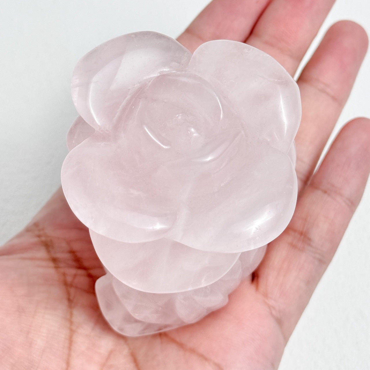 Handcrafted rose quartz floral carving for home decor