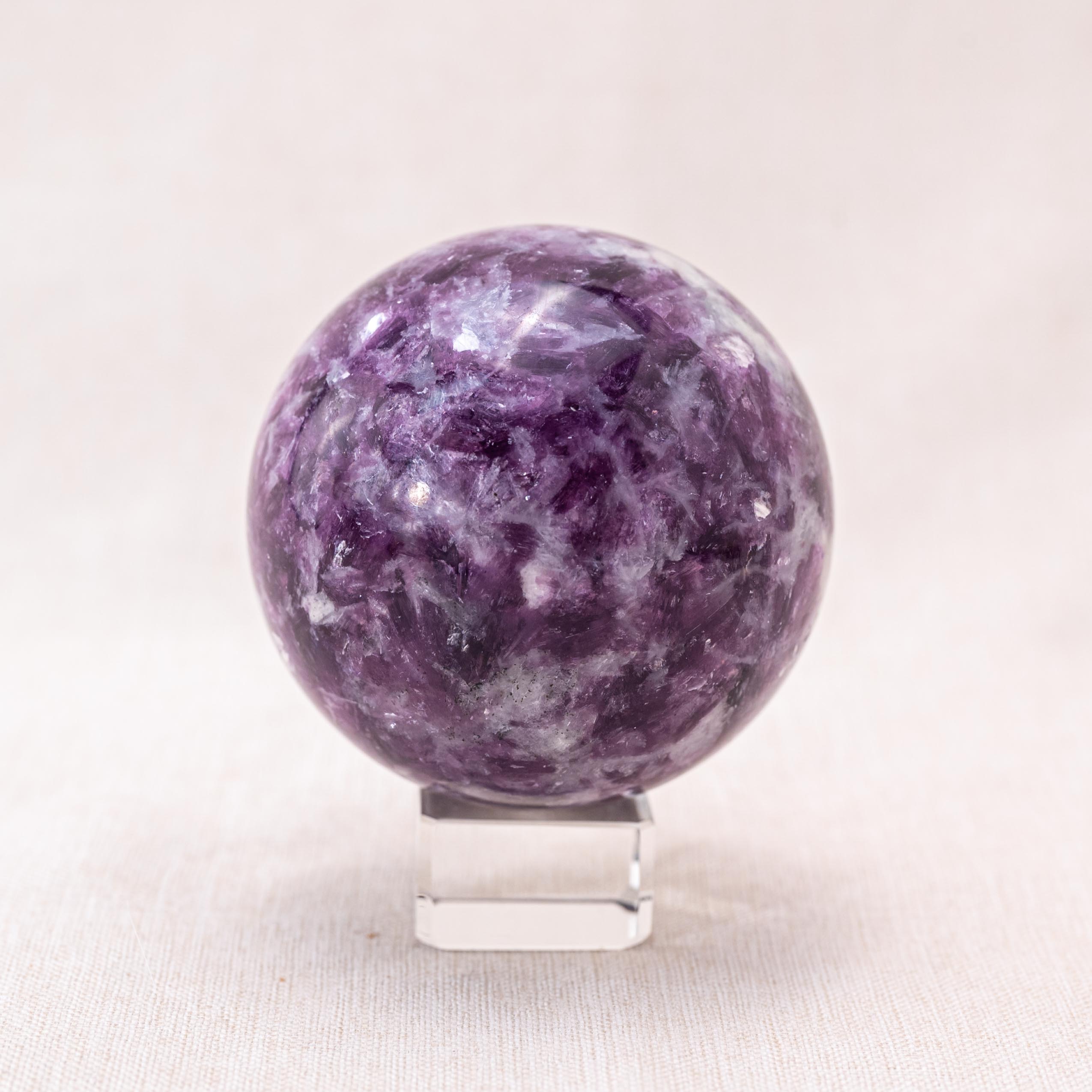 The Lepidolite Sphere serves as a healing crystal.