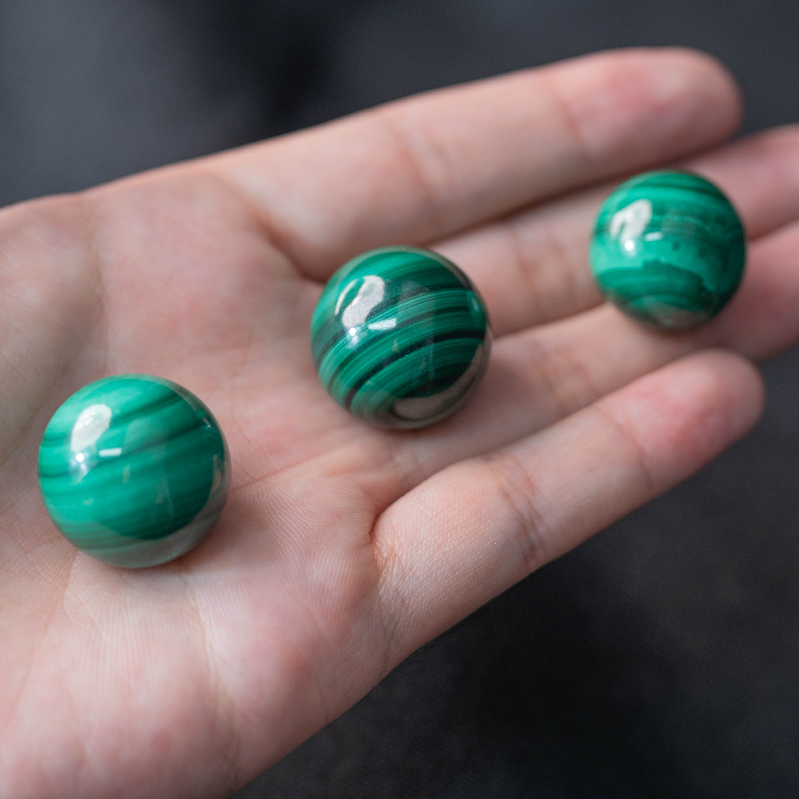 The polished Malachite Mini Sphere absorbs negative energies and enhances positive vibrations.