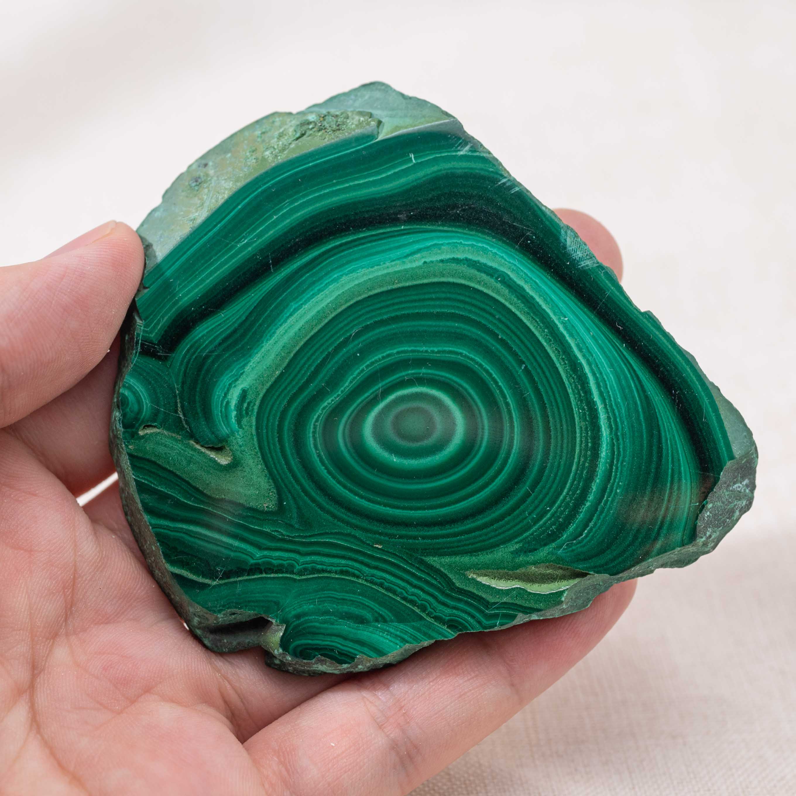 This Malachite Slab promotes healing and energy balance with its vibrant green hues.