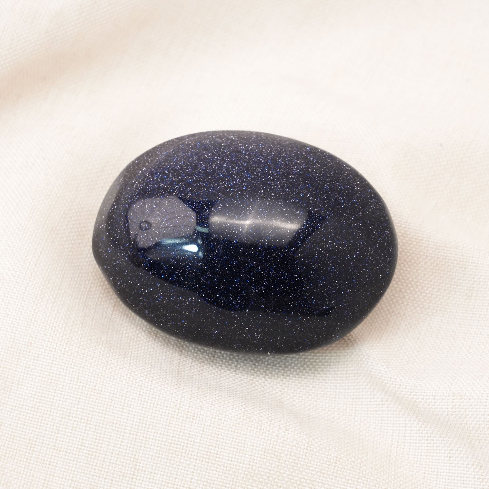 Blue Sand Stone Palm Stone known for its healing and calming properties