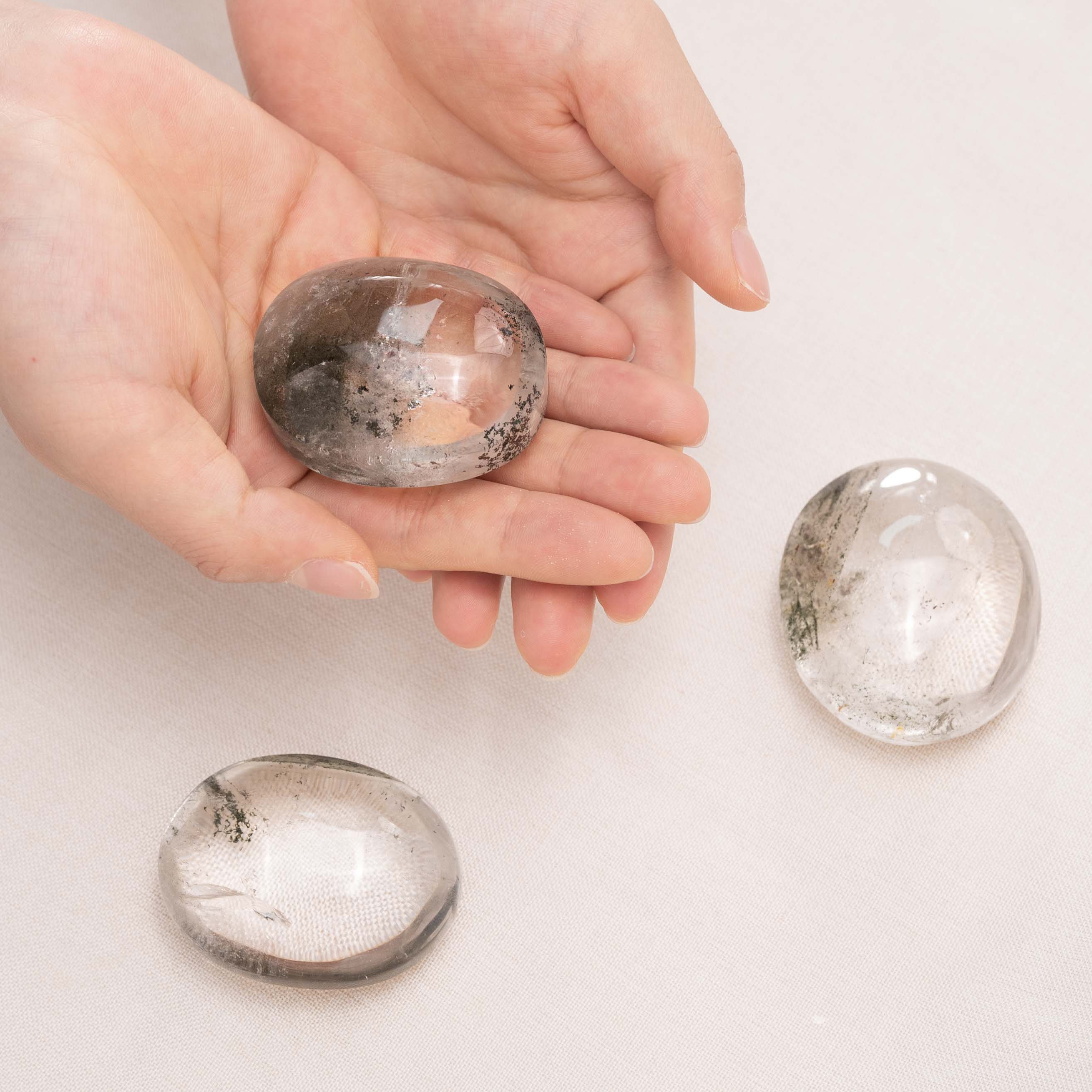 Natural Phantom Quartz Palmstone promoting emotional stability