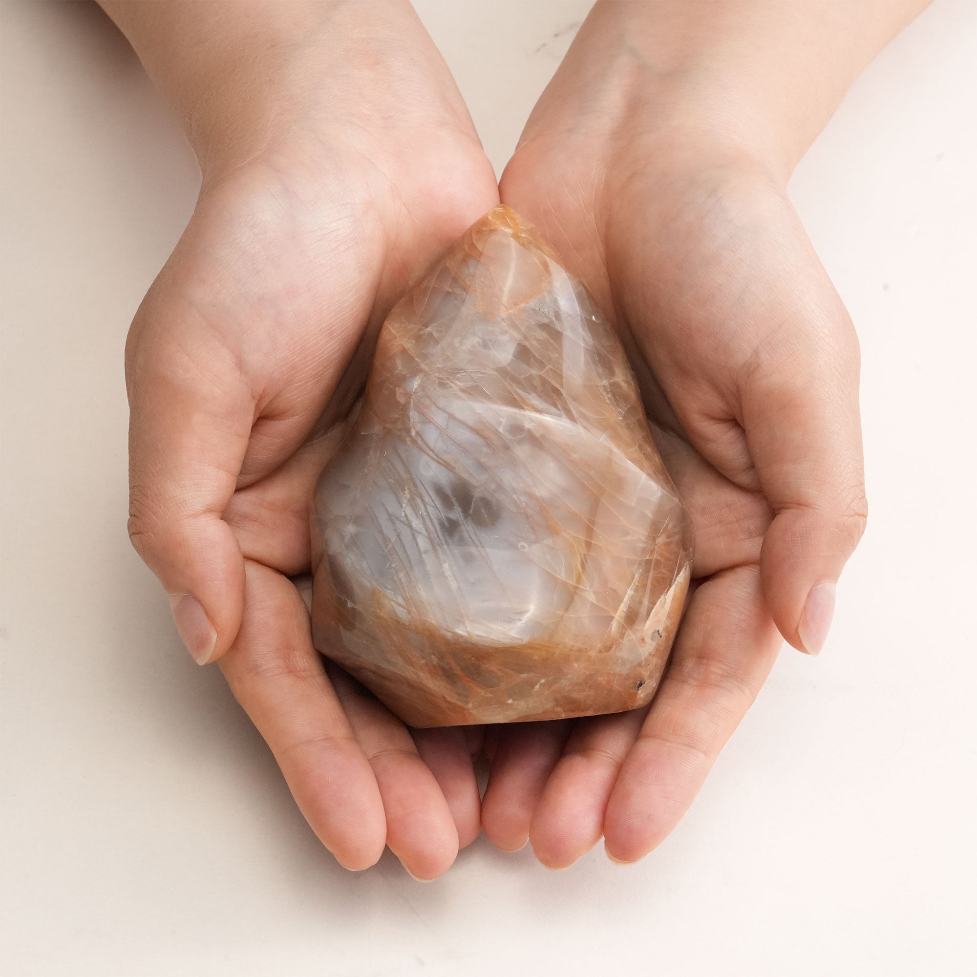 Close-up of Orange Moonstone Flame Crystal showing intricate details and shimmering colors