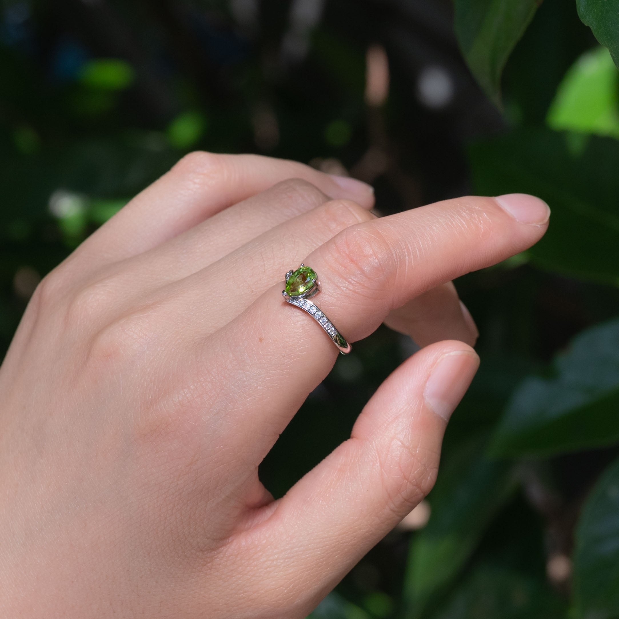 Peridot Teardrop Ring with vibrant green color.