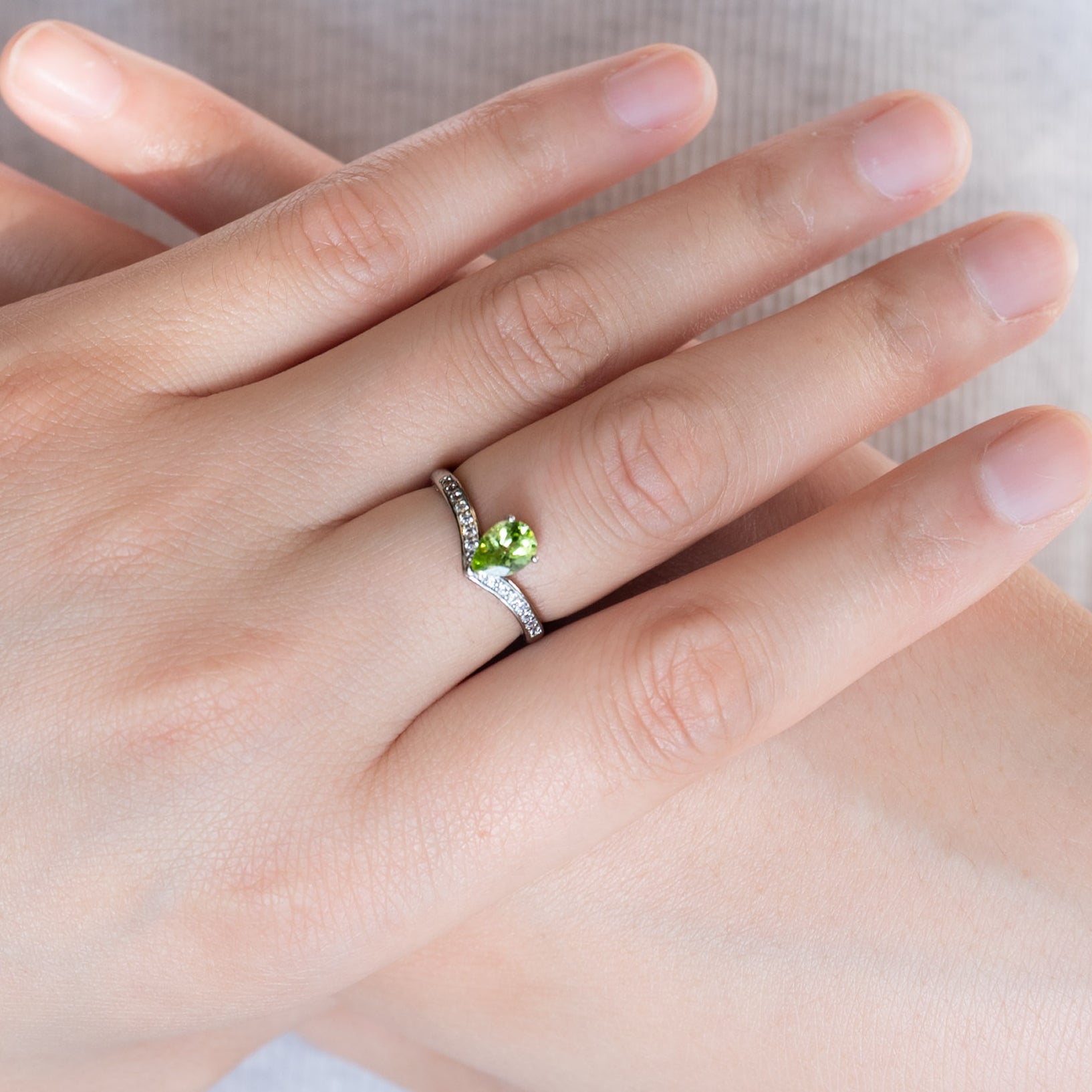 Stunning Peridot Teardrop Ring, symbolizing prosperity.