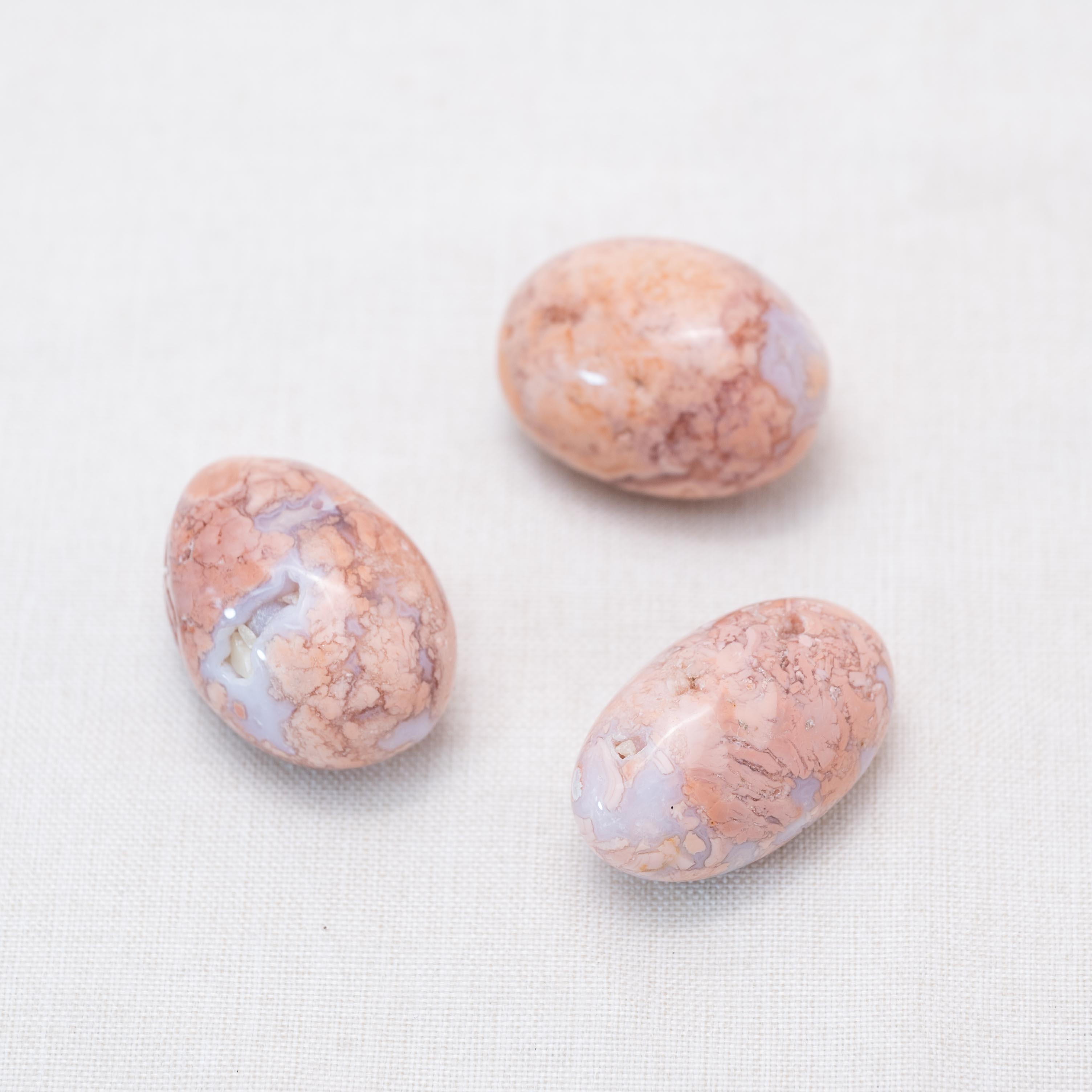 Displayed Petal Agate tumbled stones for calming energy.