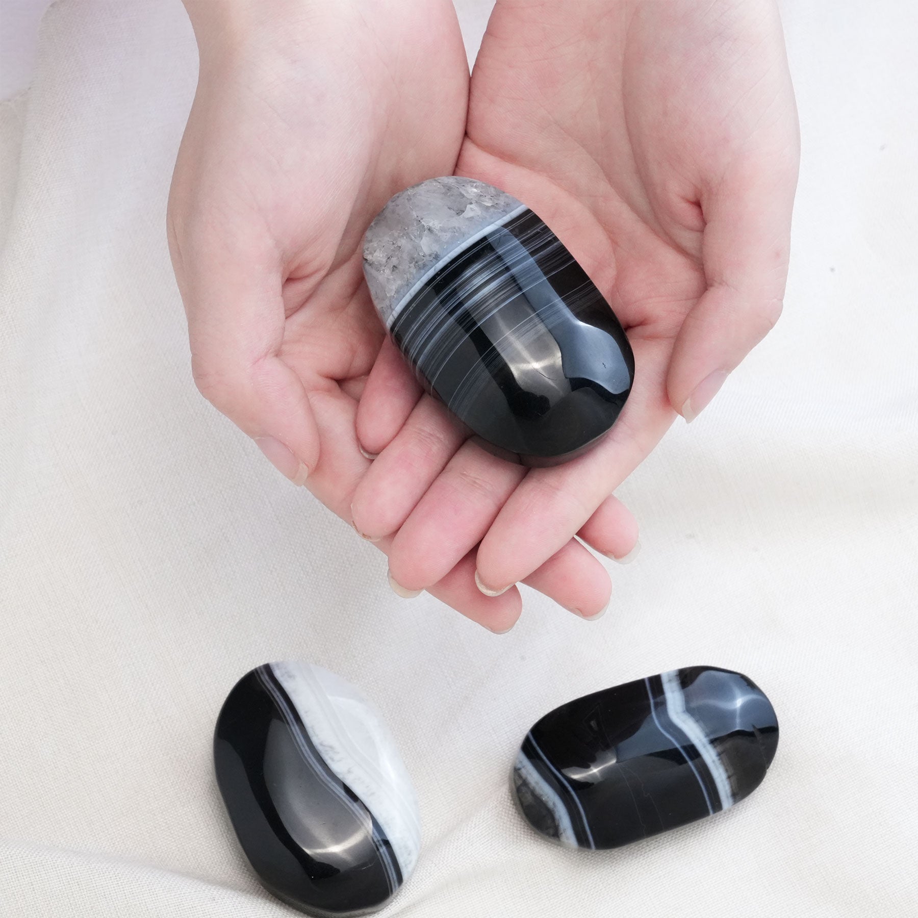 This unique crystal palm stone is perfect for meditation, fostering a sense of inner peace and well-being