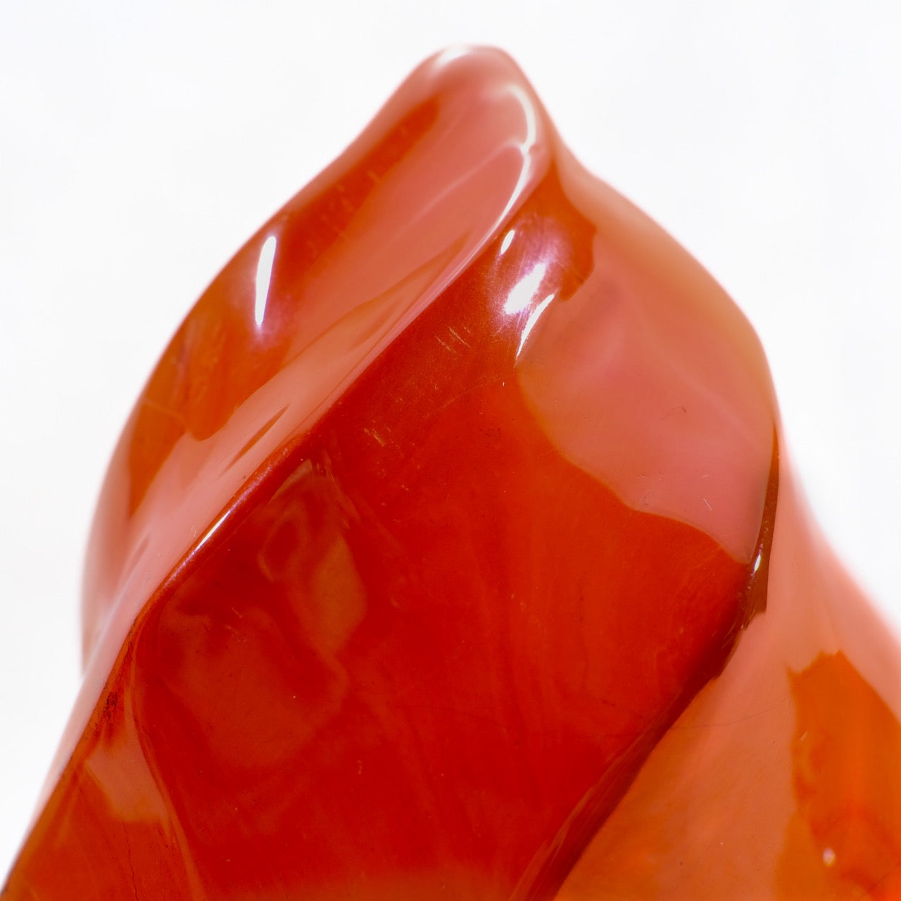 Close-up of Red Jasper Flame crystal pointing upwards