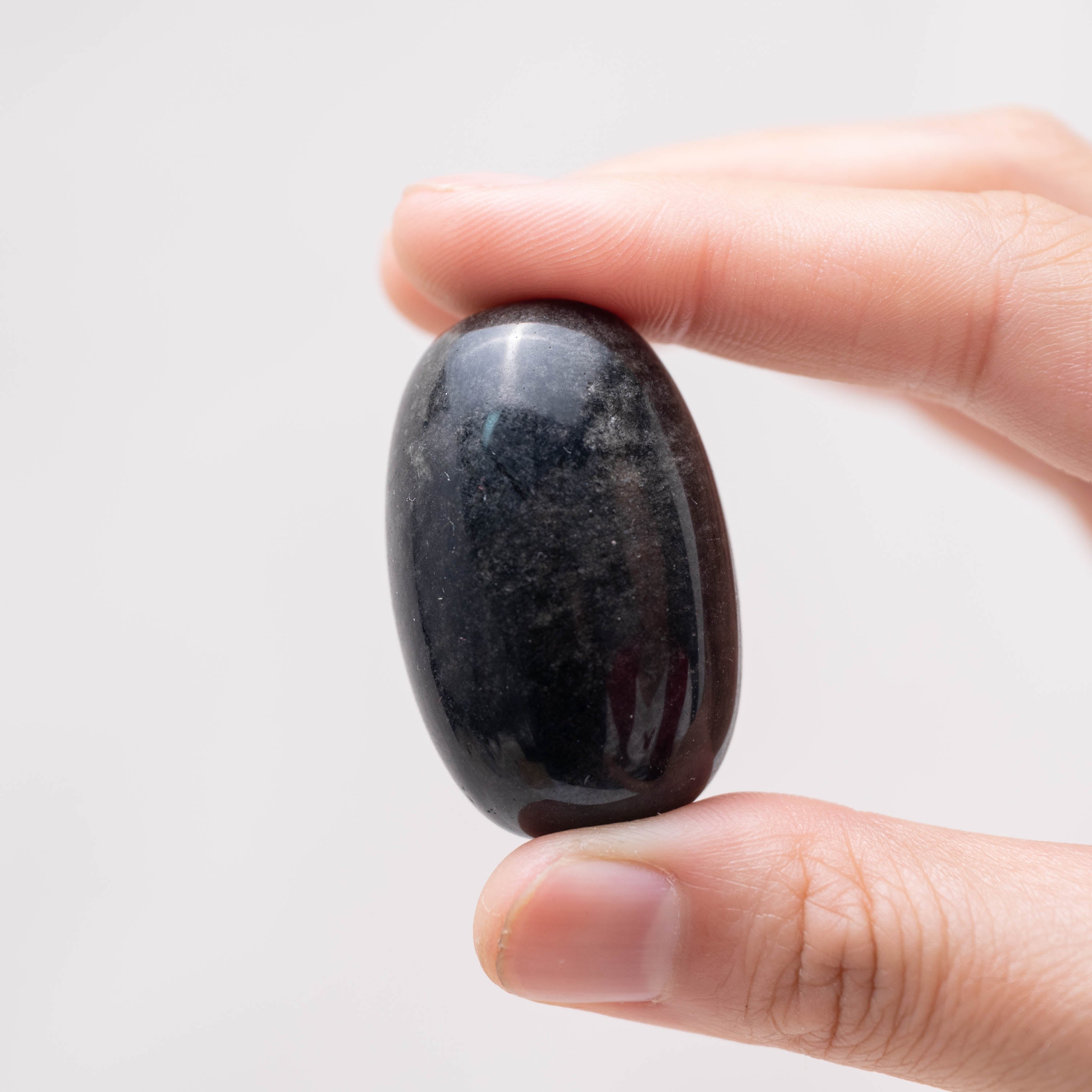 Laid-out Silver Obsidian tumbled stones for cleansing energy