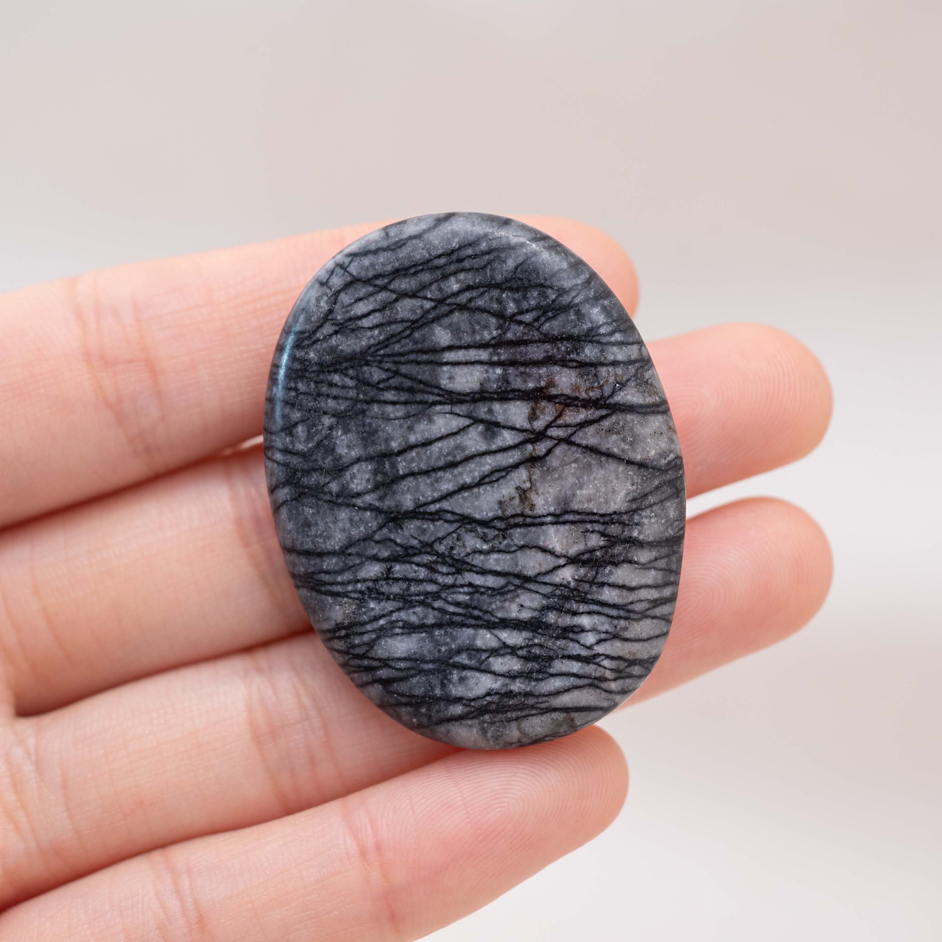 Enhance your meditation with the Black Net Worry Stone, promoting emotional stability