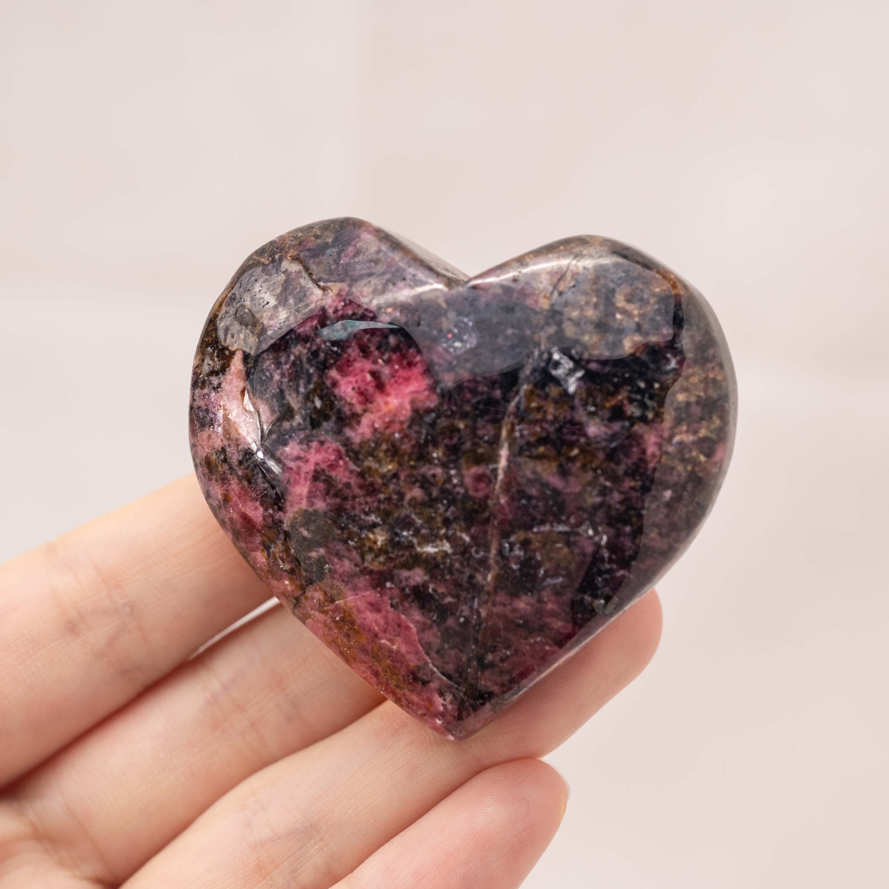 Pink Rhodonite Heart supports emotional healing by helping to release past traumas and negative emotions