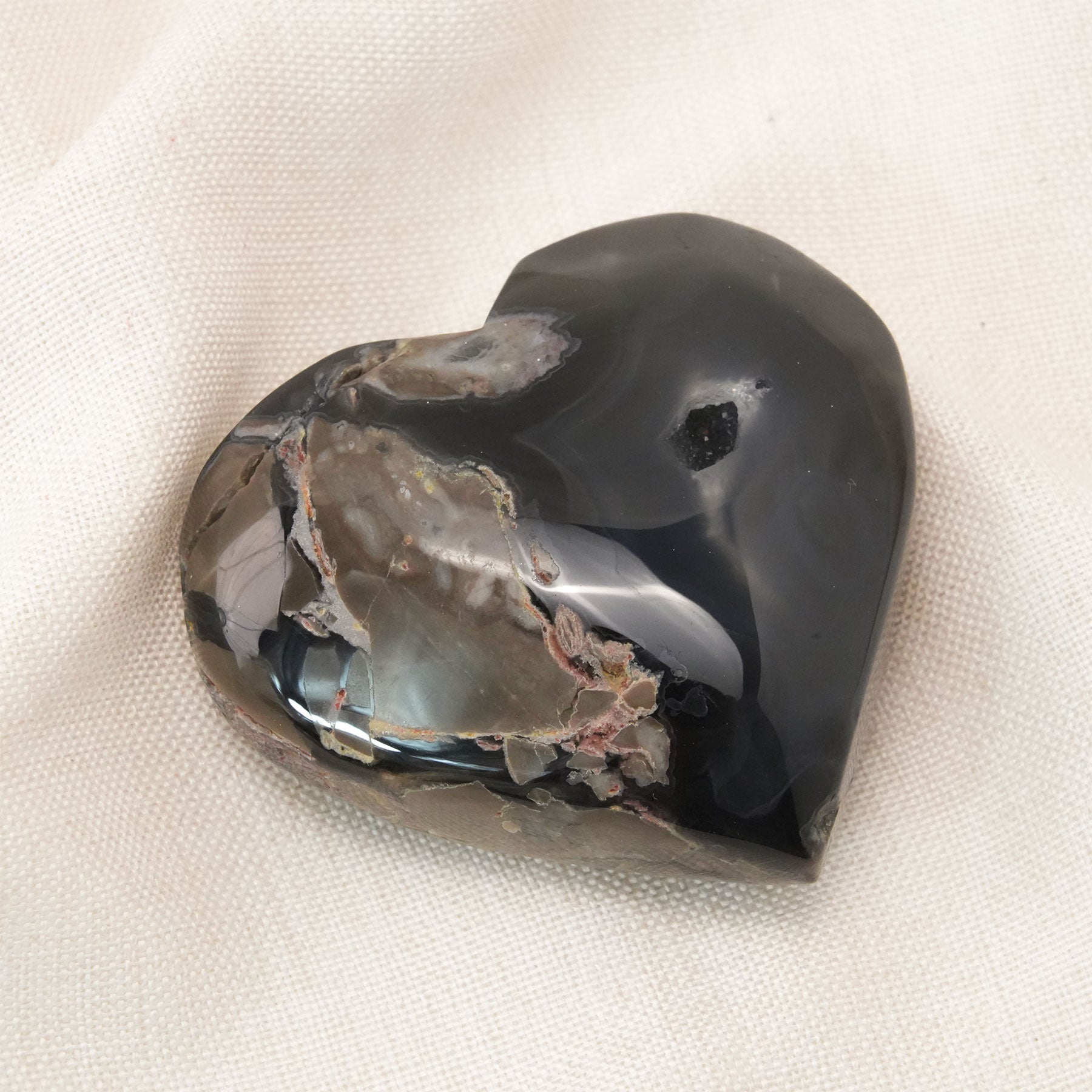 The Volcanic Agate Heart is a powerful healing crystal known for its vibrant energy and grounding properties.
