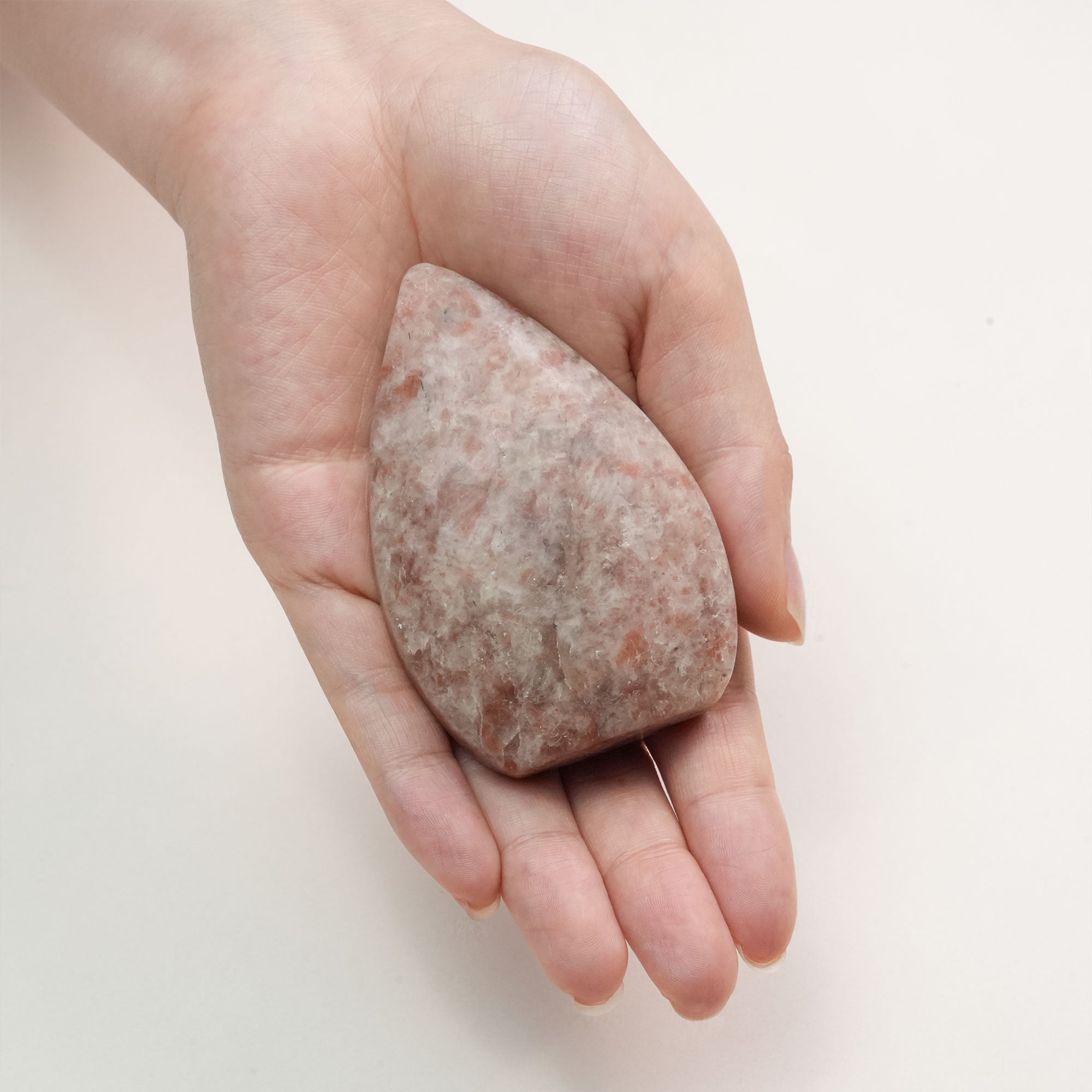 Unique Sun Stone earrings, shimmering in sunlight