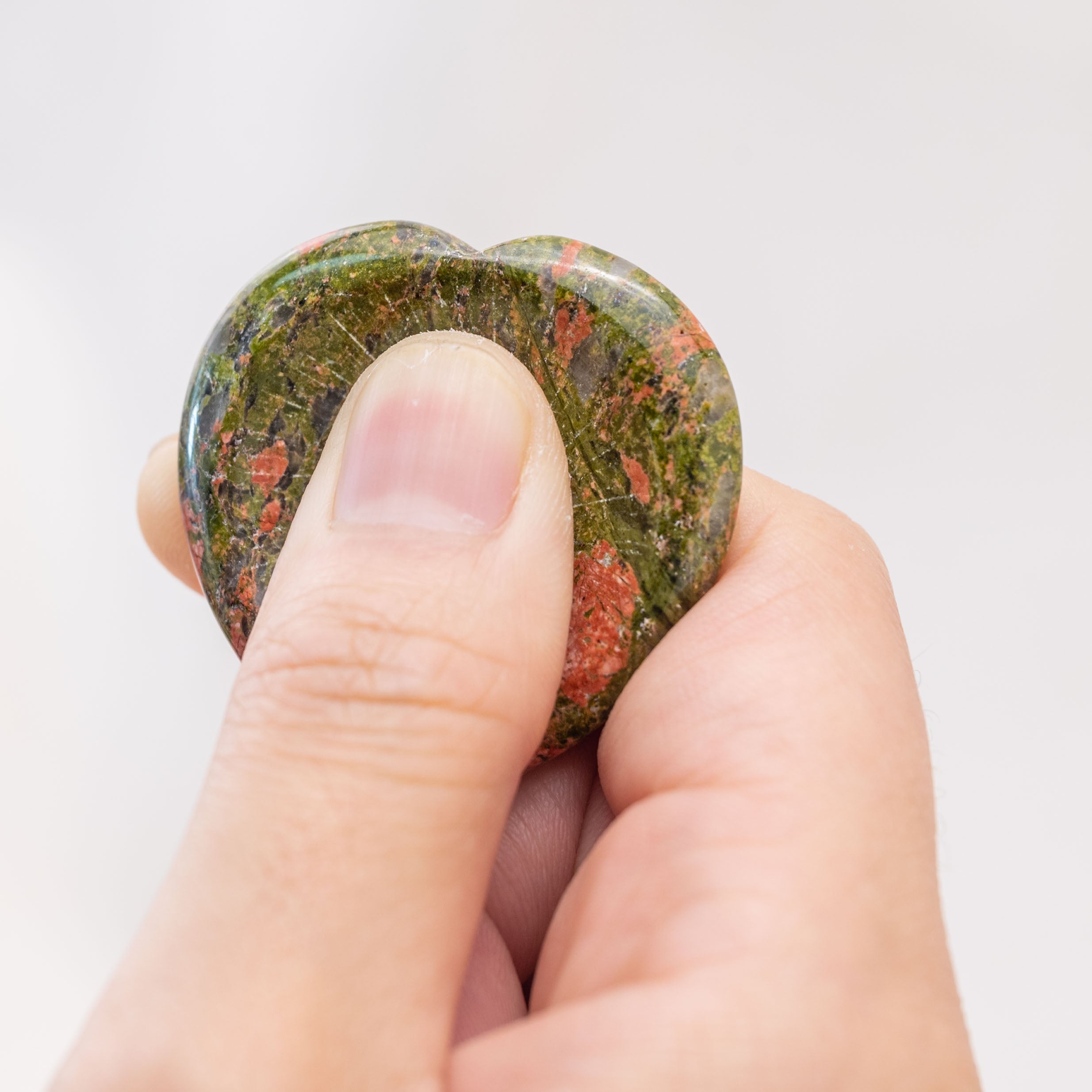 The Unakite Heart Worry Stone promotes emotional stability and clarity