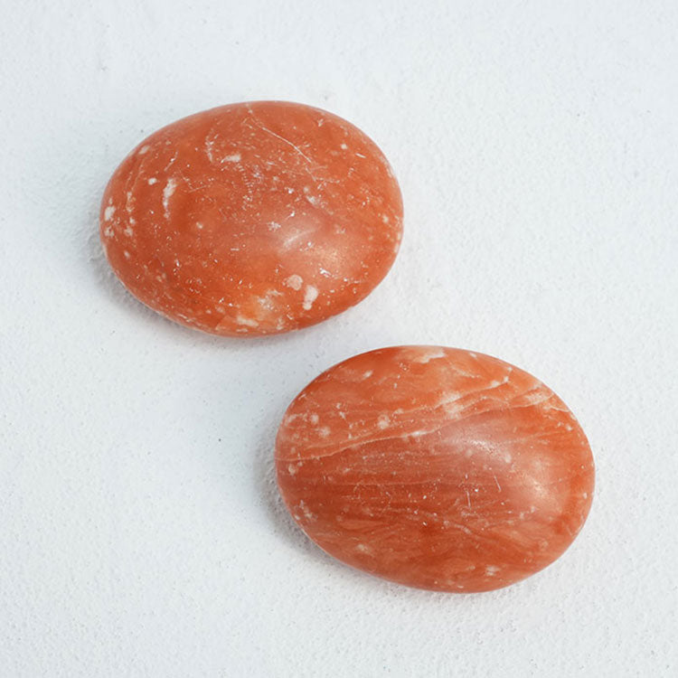 Handheld dyed red selenite for emotional well-being and safety