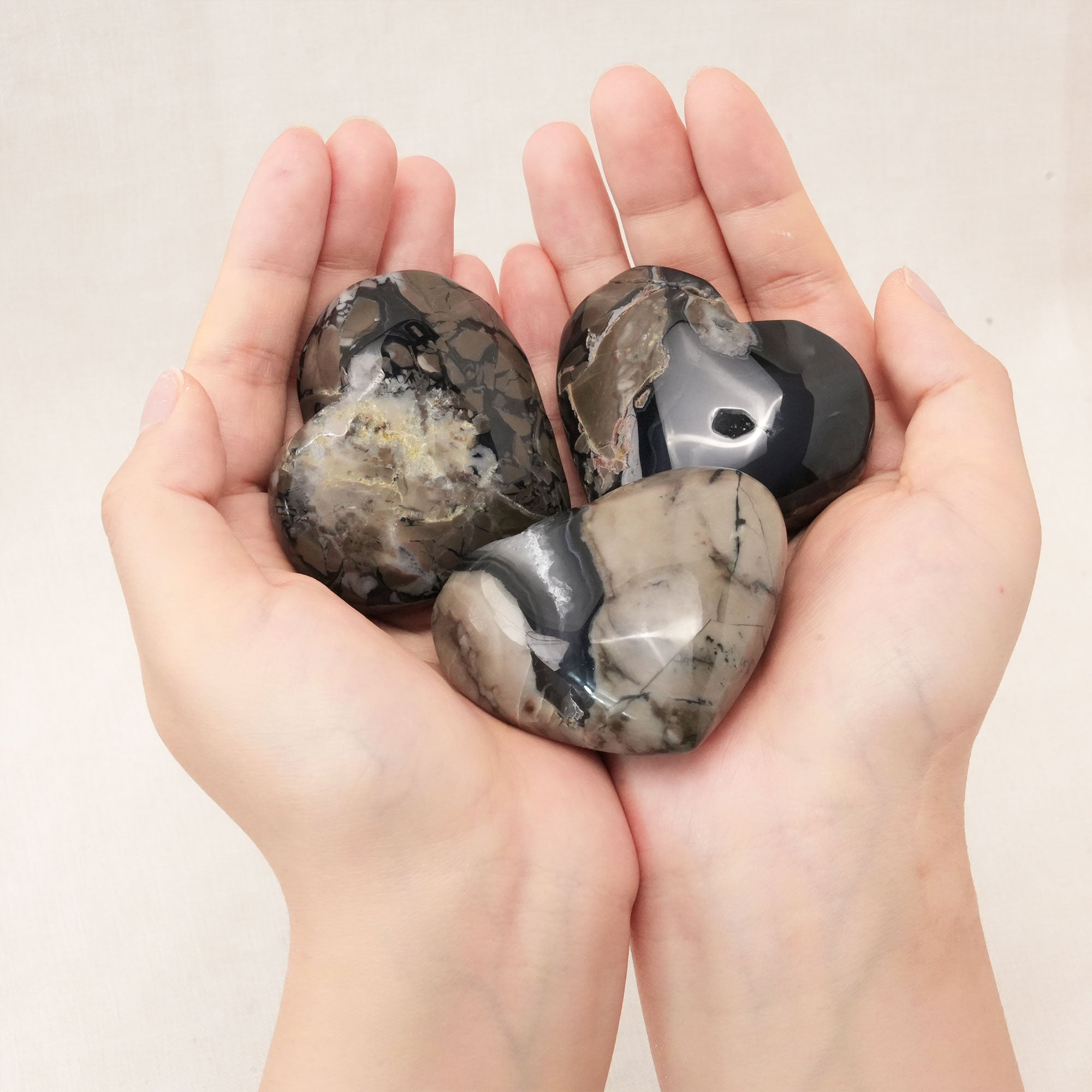Handcrafted from natural volcanic agate, this heart promotes emotional stability and enhances spiritual growth