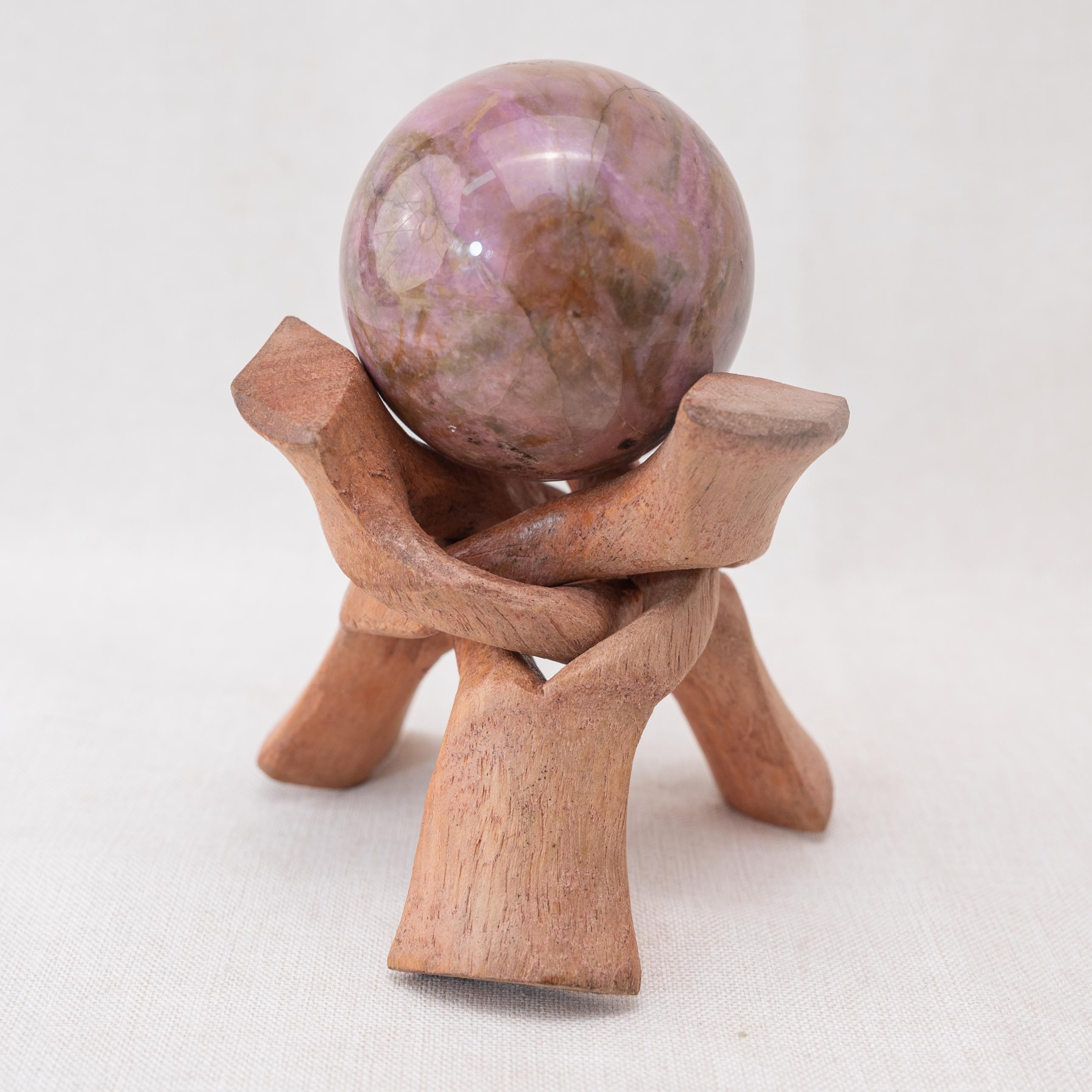 This handcrafted wooden tripod stand ensures your crystals are displayed securely and beautifully.