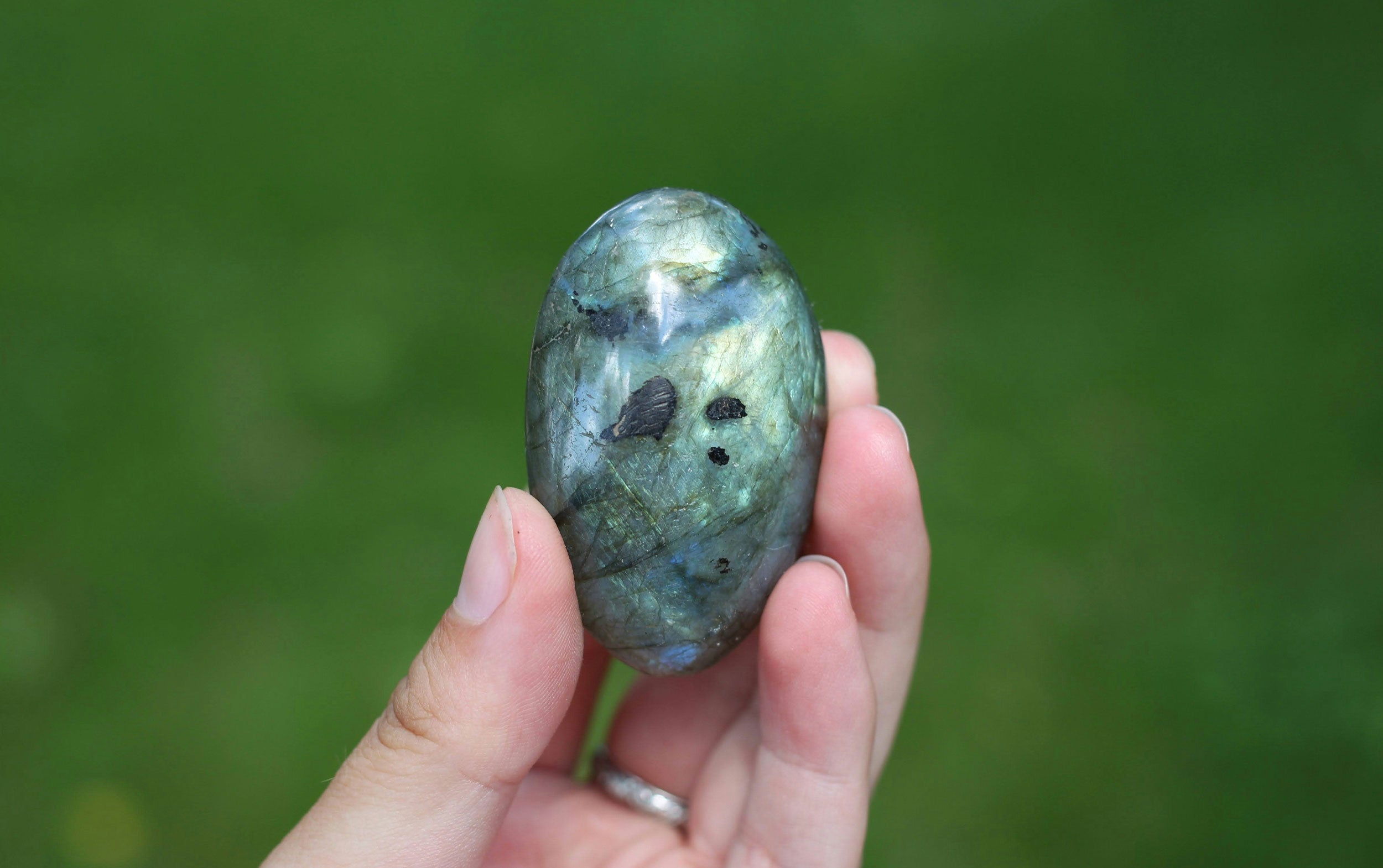 Vibrant labradorite stone showcasing its unique iridescent play of colors with blues