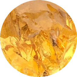 Polished Citrine crystal sphere radiating golden hues on a display stand