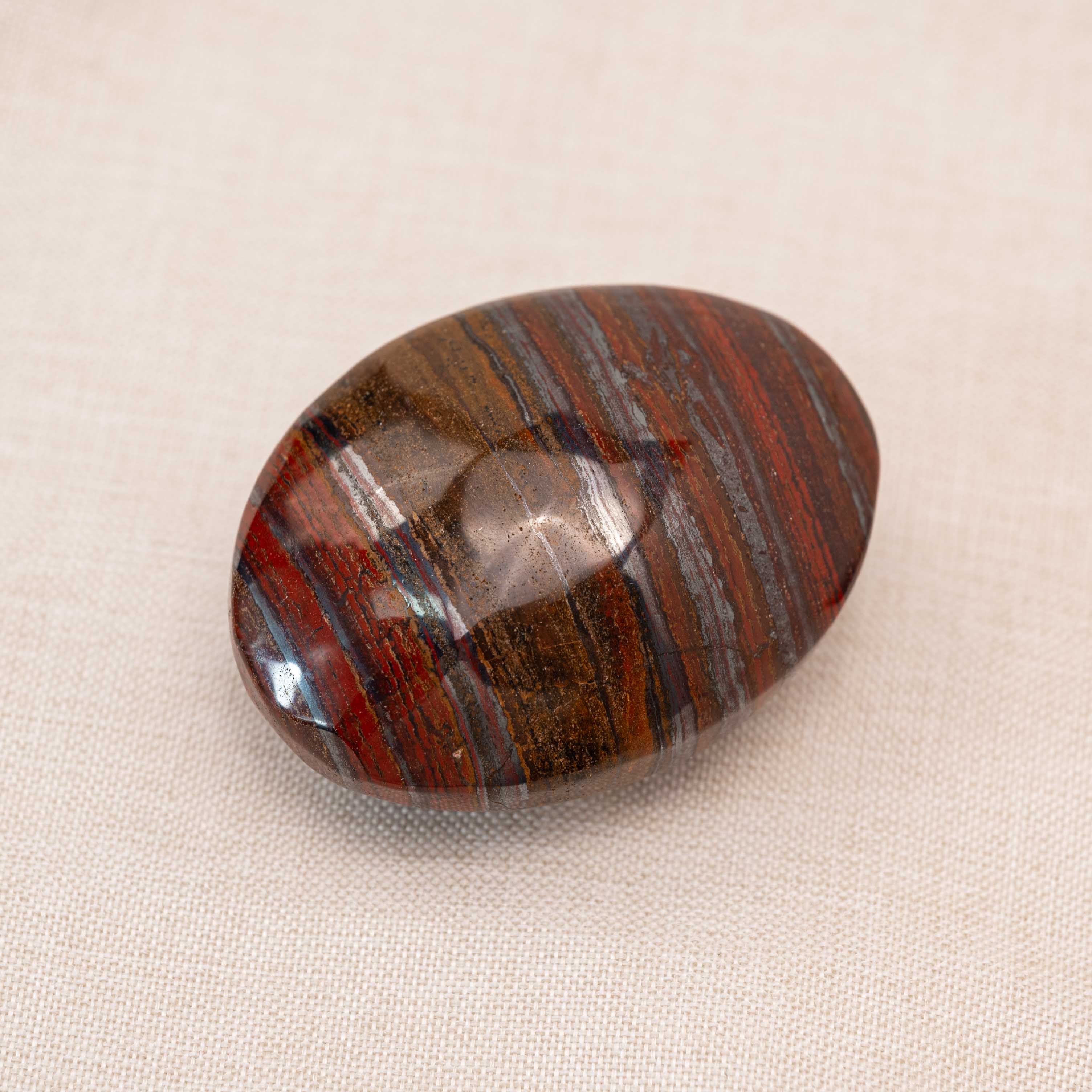 Iron Tiger Eye Stone Palm Stone representing serenity and courage