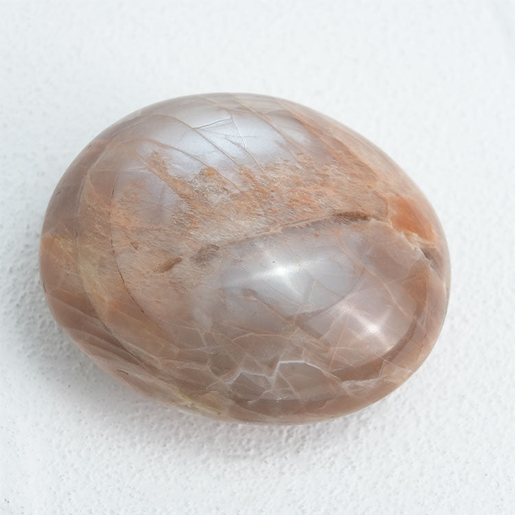 Natural Orange Moonstone Palm Stone, a symbol of inner peace and spiritual connection