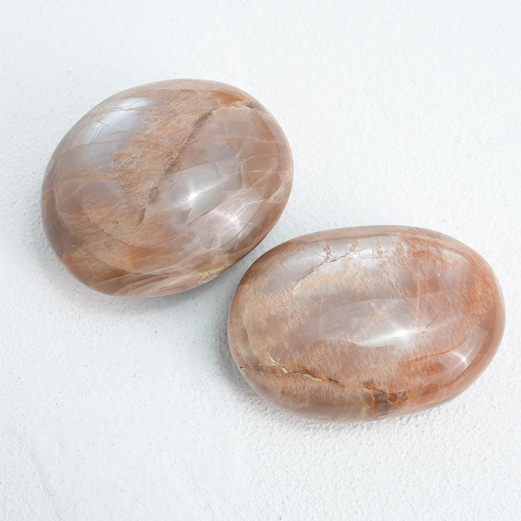 Detailed view of Orange MoonStone Palm Stone, perfect for enhancing sensuality