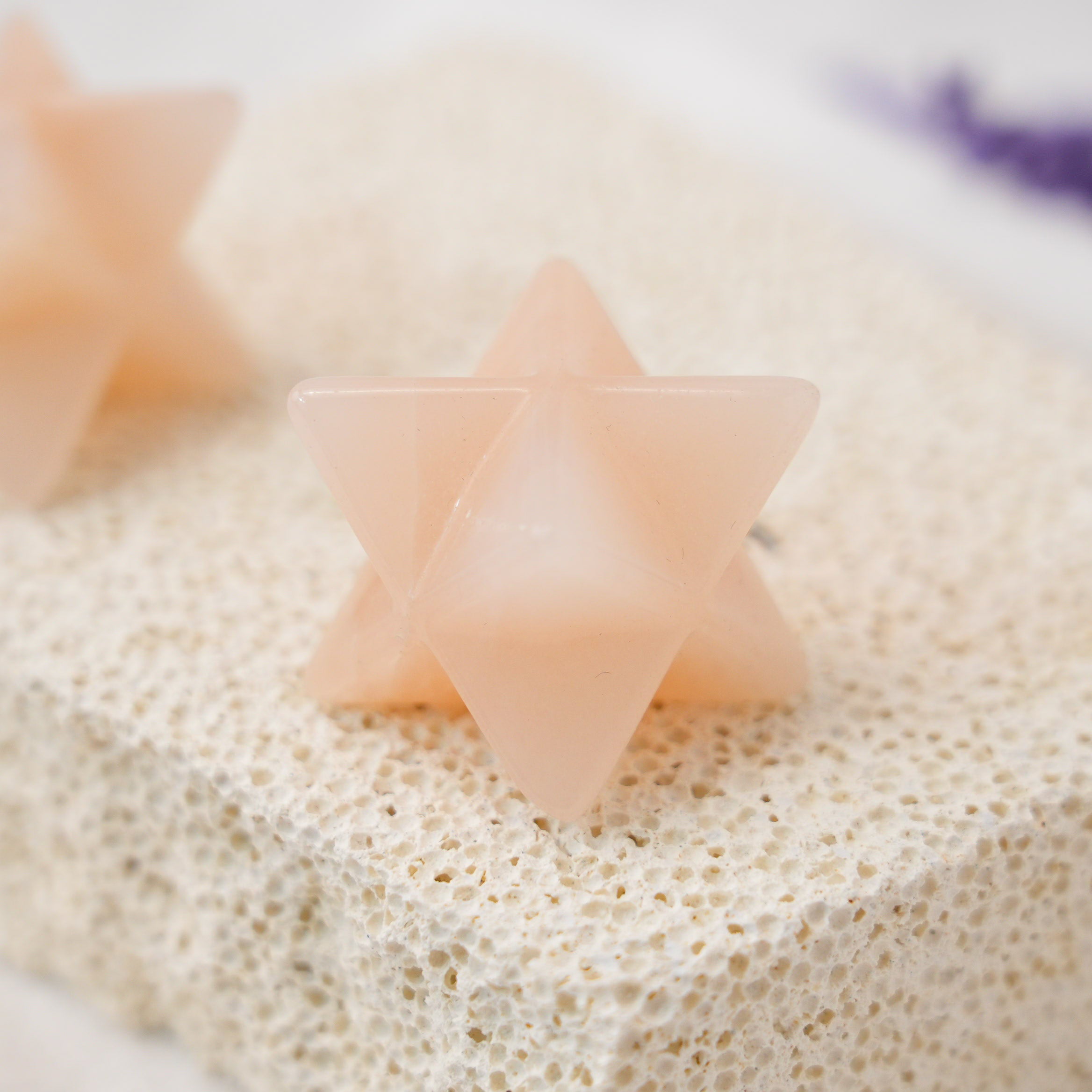 A beautifully carved Pink Aventurine Merkaba for enhancing love and compassion in your life