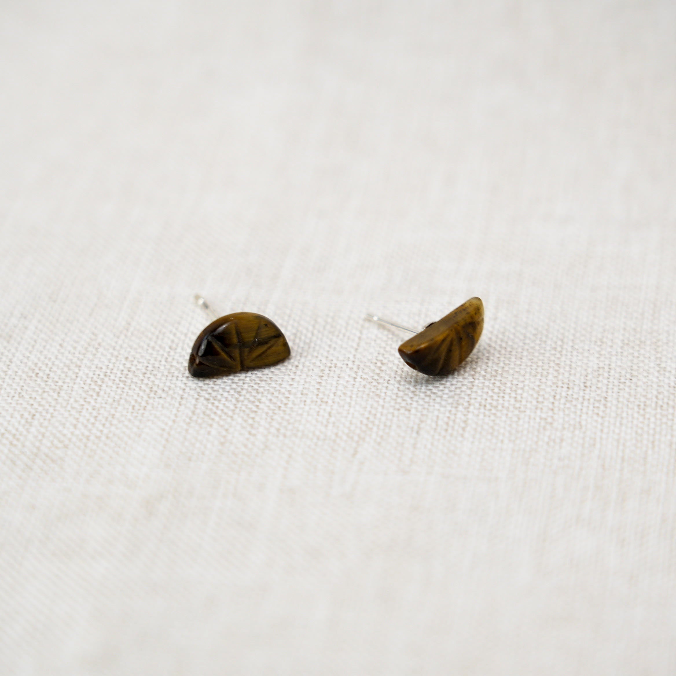 Stunning tiger eye stone teardrop earrings set in silver, perfect for gifting or personal use.