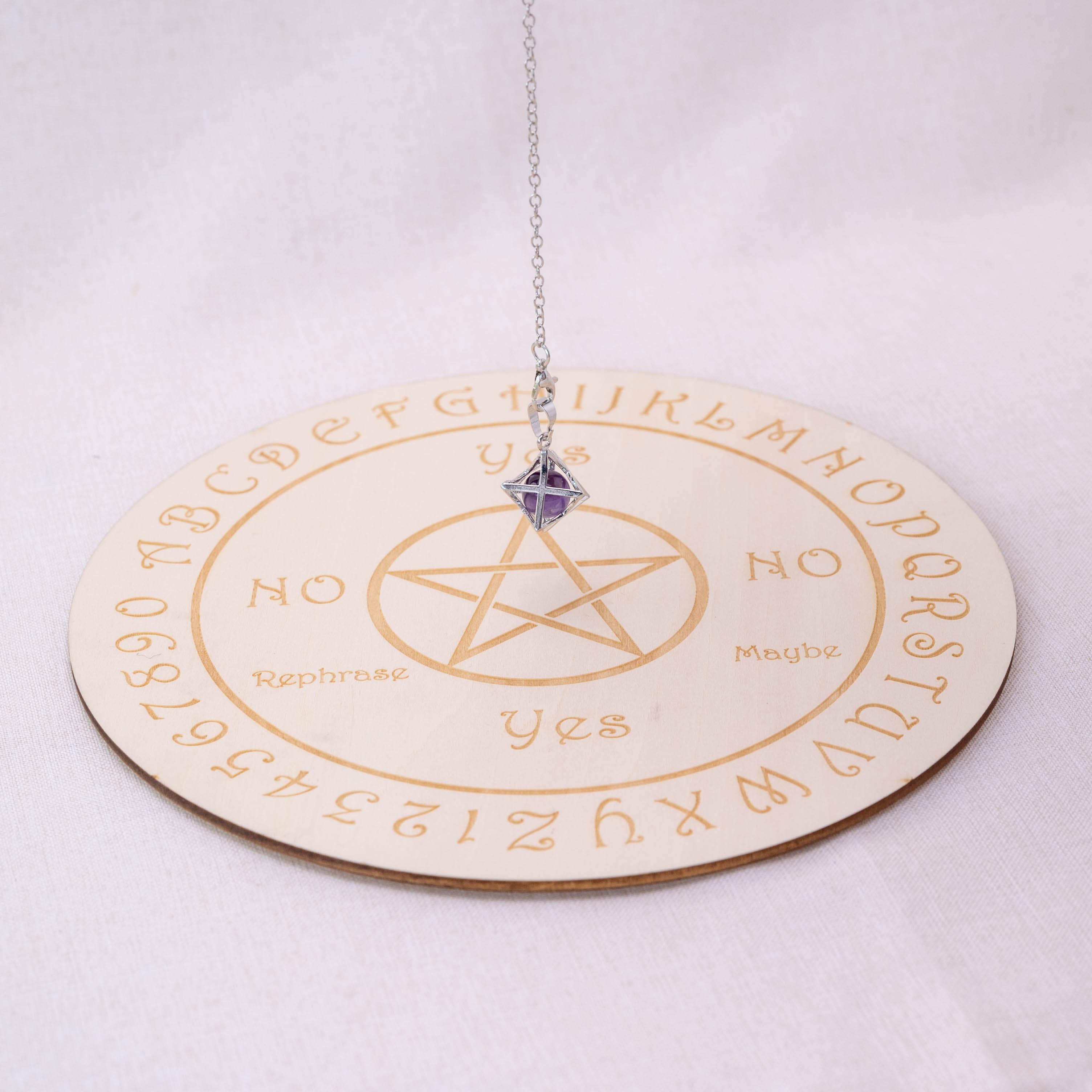 Detailed view of Amethyst Merkaba-shaped pendulum