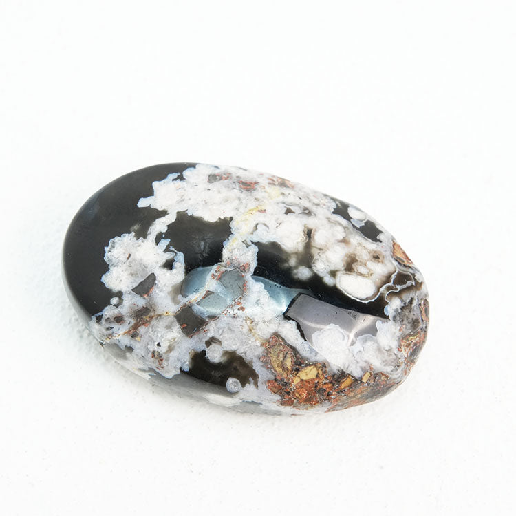 Black Flower Agate Palmstone, a symbol of tranquility and balance